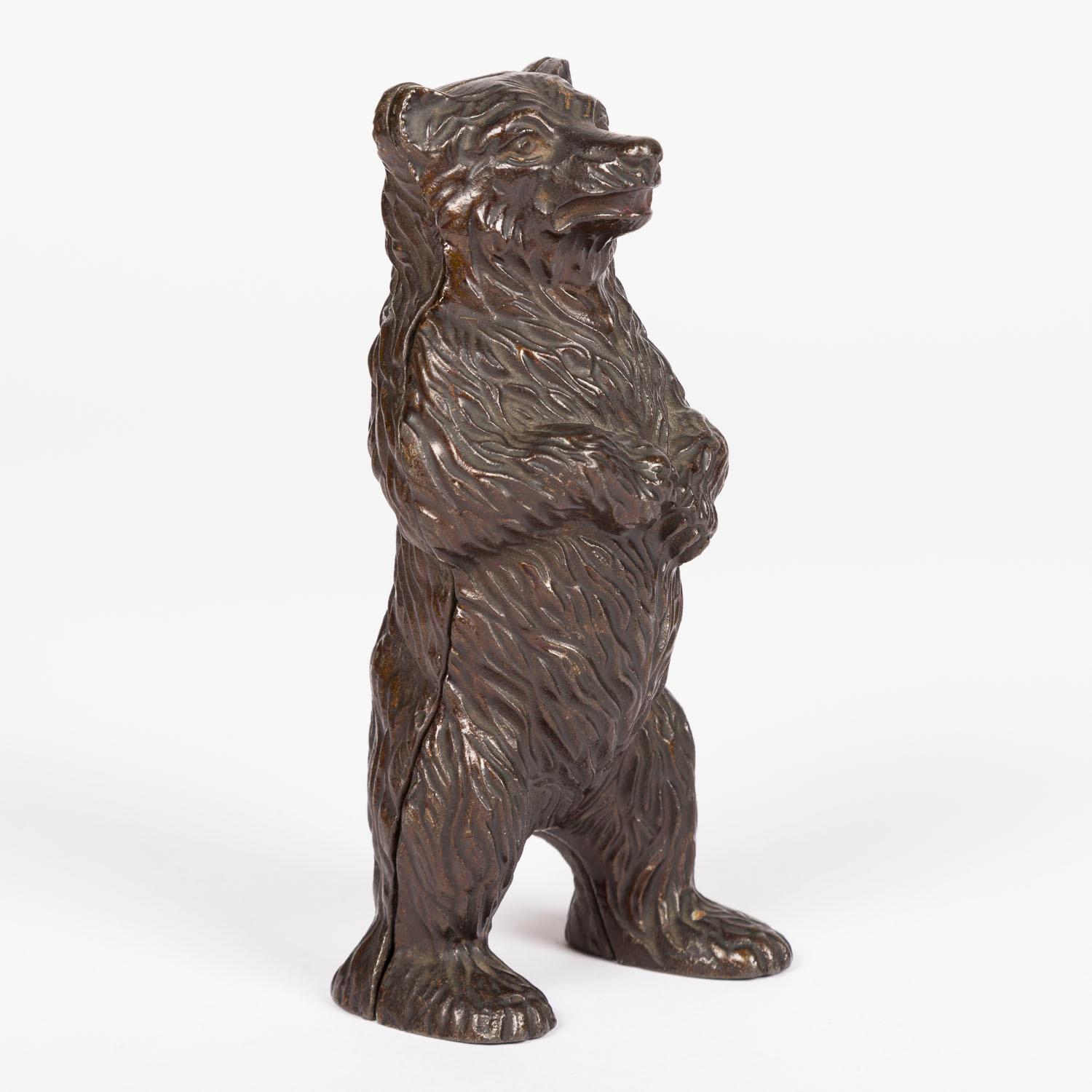 A late Victorian patinated cast iron standing bear money box, registered design by John Harper & Co.  

John Harper Co. Ironfounders, Albion Works, Willenhall, Staffordshire, England. Founded by lock maker William Harper in 1790.
