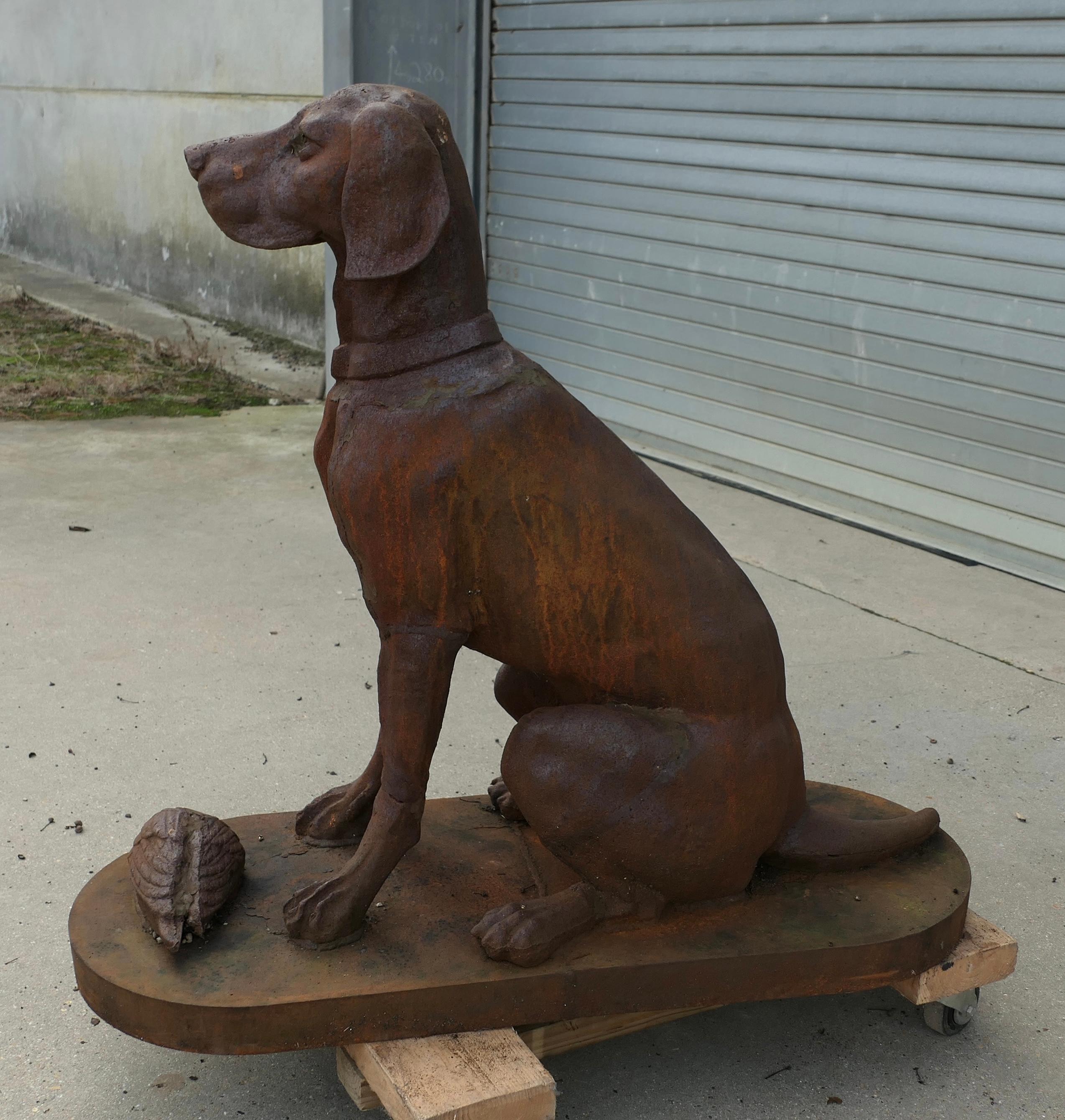 Cast Iron Statue of a Hunting Dog Retrieving a Pheasant 

A very proud Chap, he is sitting on a deep plinth he is fully 3 dimensional and looks good from all sides
Our faithful hound is sitting waiting for the attention of his master with his quarry