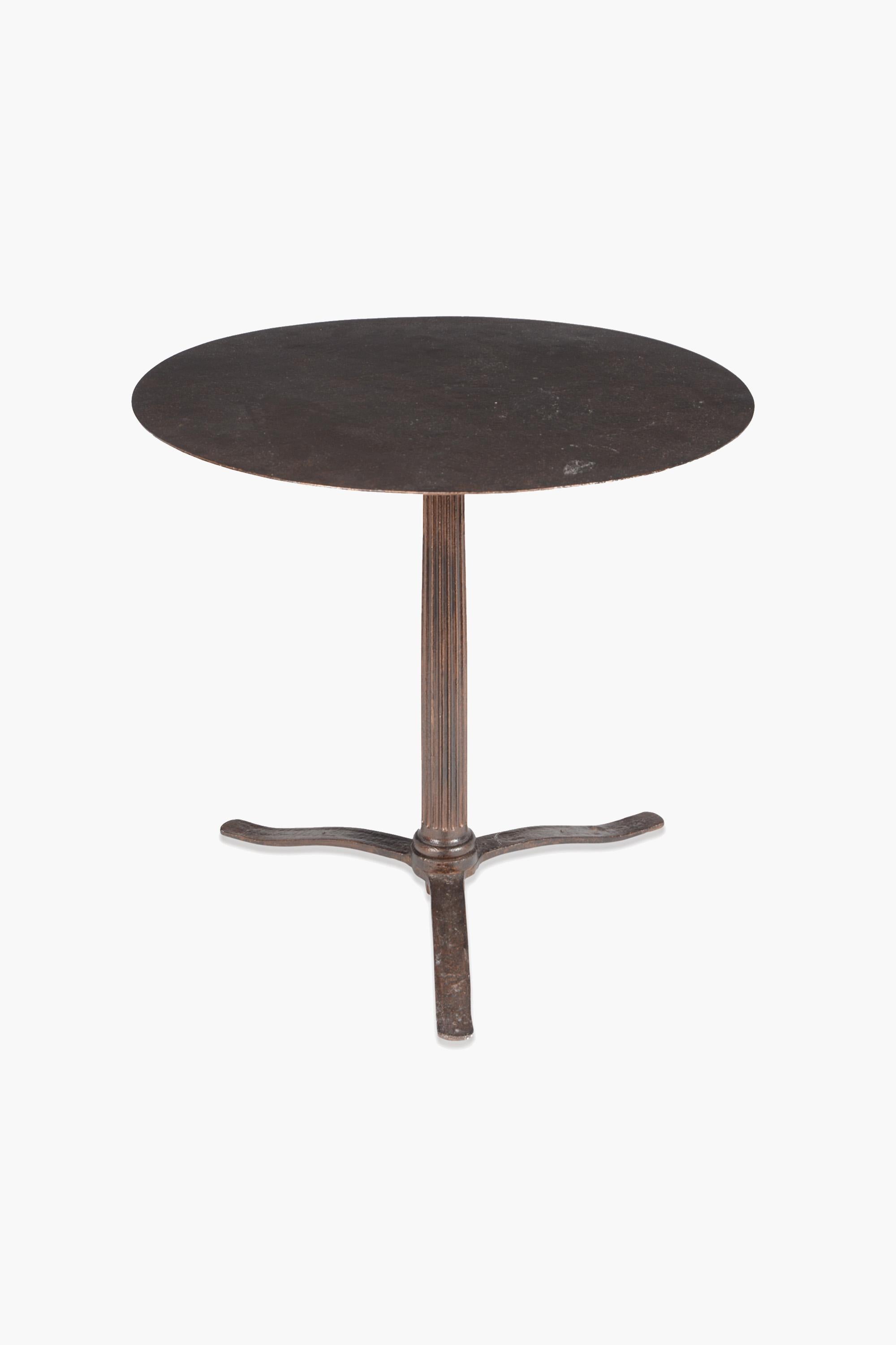 Cast iron table, 19th century

A late 19th Century cast-iron table in the manner of a George III centre table.

The circular top above a fluted column support and three outswept flat legs.

Recently restored ironwork. Could be fitted with a