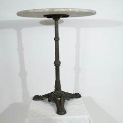 Cast iron table with marble top made ca year 1900