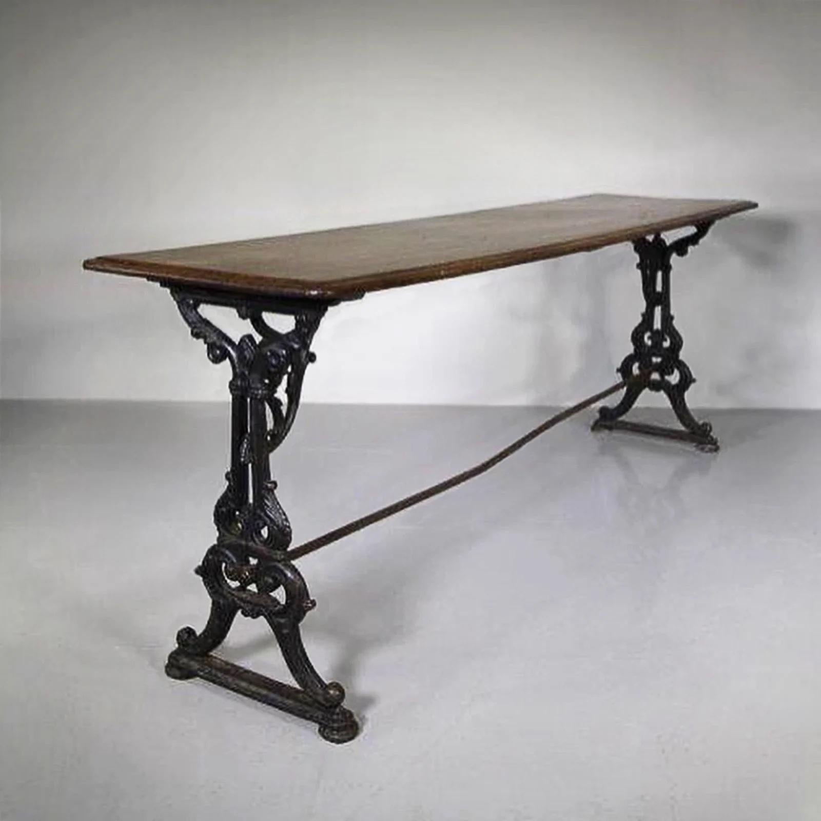An unusual and charming trestle table, the top a single piece of beautifully coloured mahogany on an ornate cast iron base.
English c. 1865
H: 77cm (30.31in) W: 208cm (81.89in) D: 54cm (21.26in)