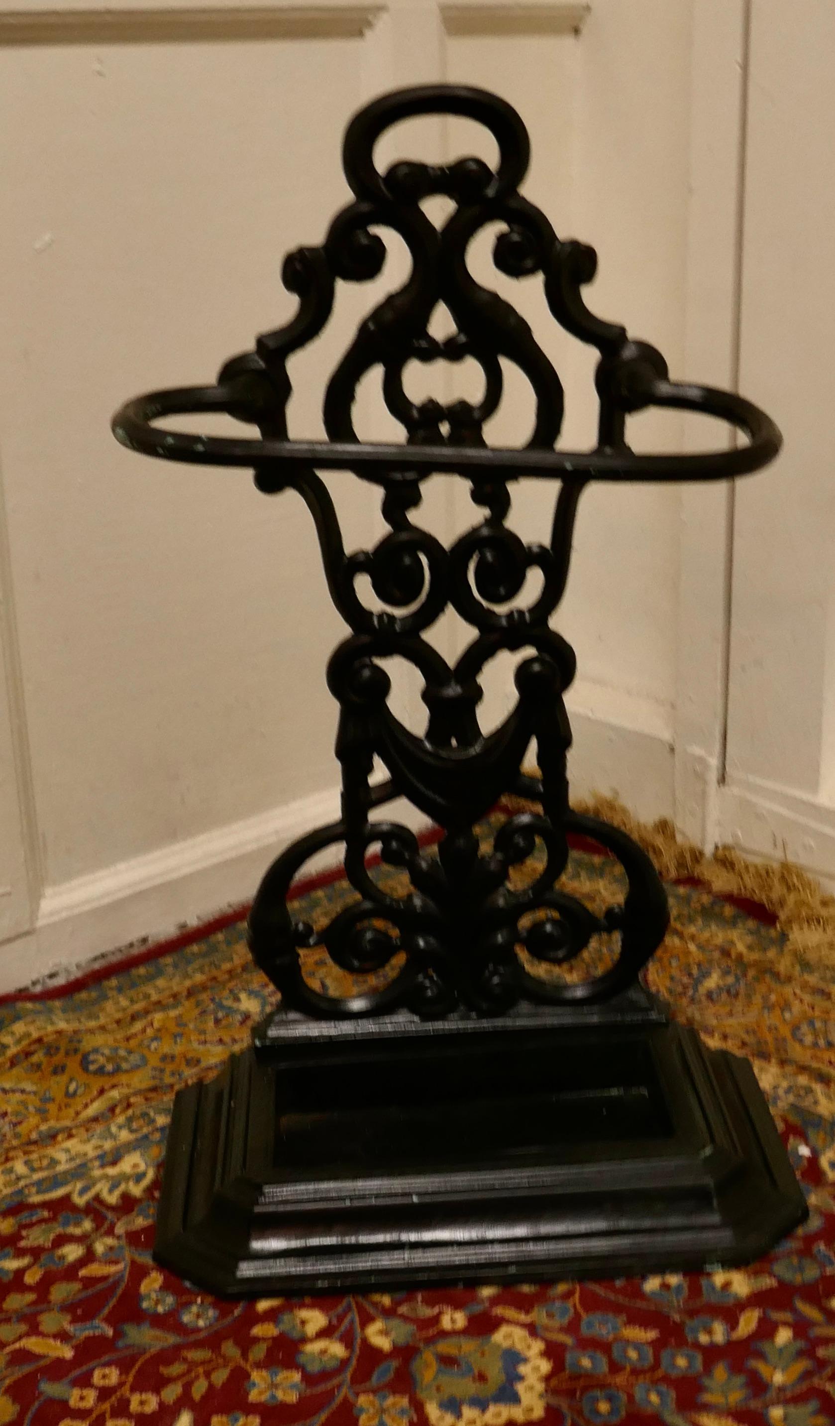 Cast iron umbrella or stick stand

An attractive cast iron stand with a curved support rail and removable umbrella drip tray and a tall decorative back
This hall stand is in great condition and will hold al sort of Umbrellas and Walking