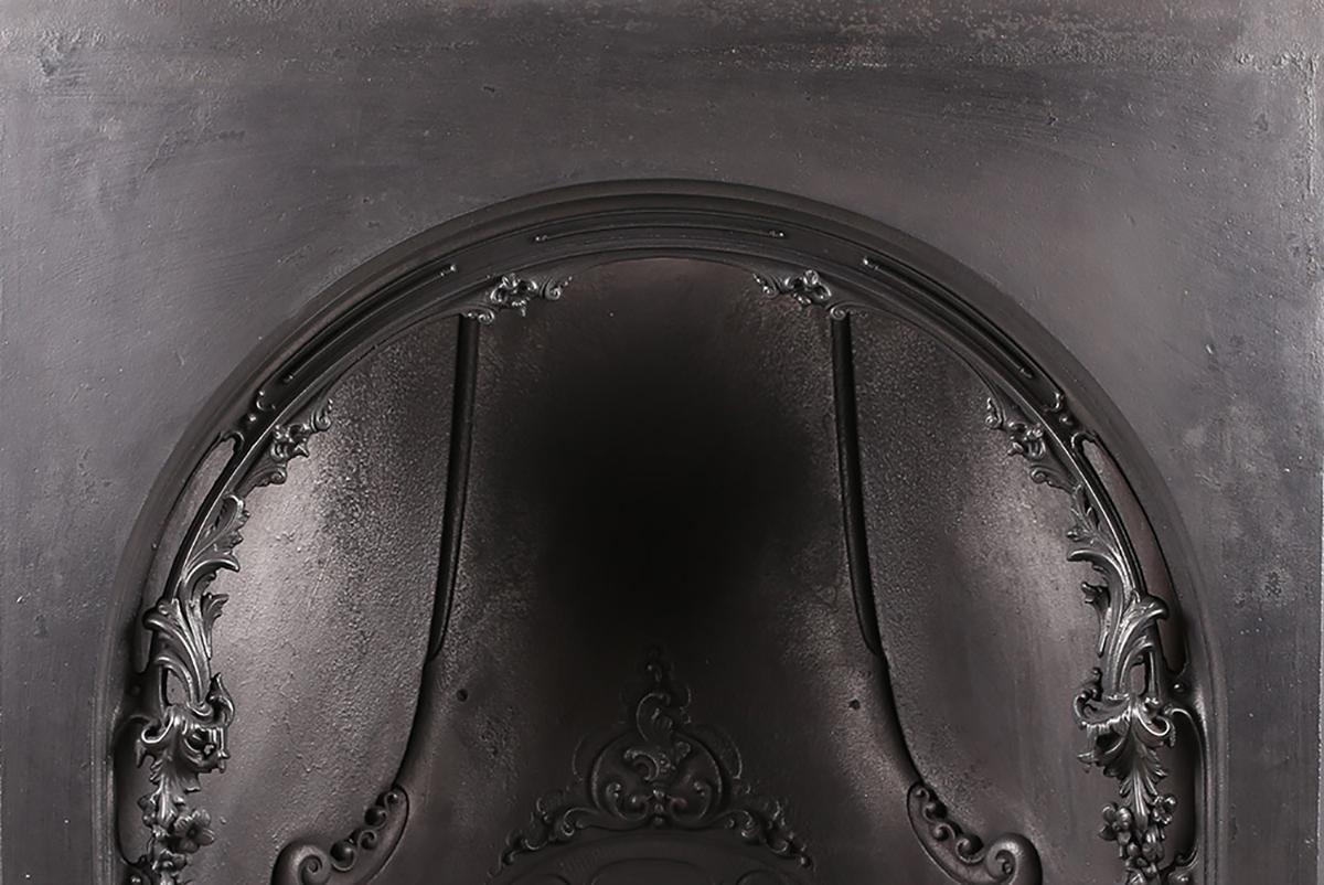 Cast iron Victorian antique arched fireplace insert, mid-19th century

Measures: Depth: 13