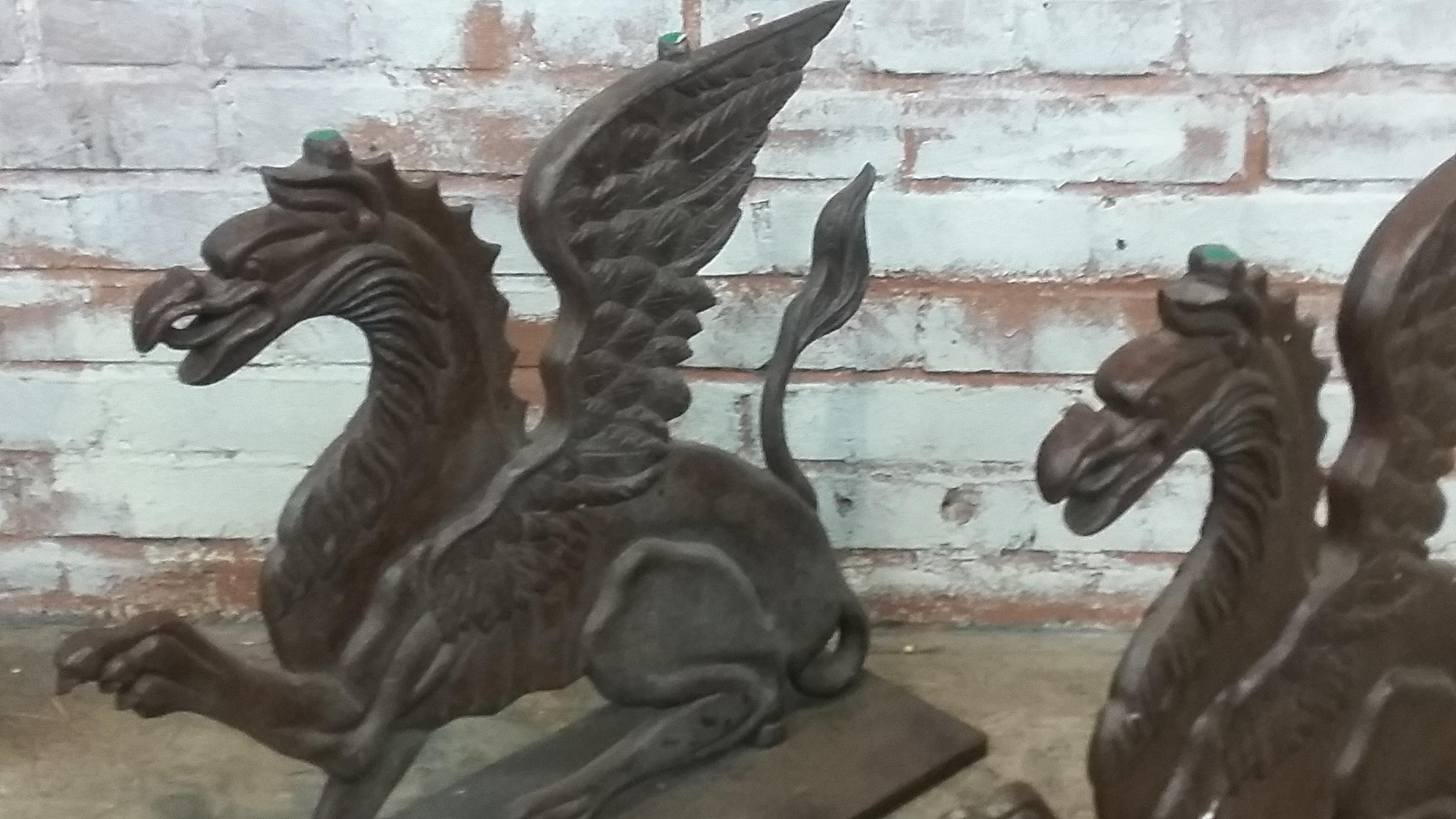 Unique set of Victorian 19th century cast iron griffin bases. Solid and heavy cast iron. Unsure of original purpose but ideal for cocktail table. Glass not included.
