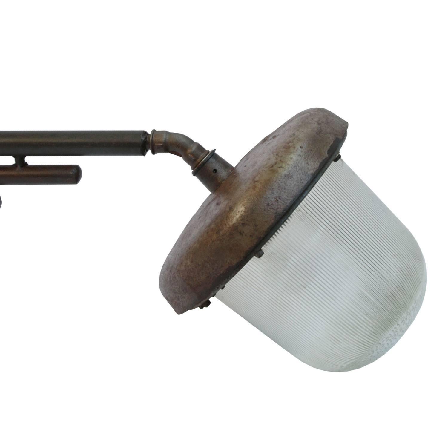 Large industrial wall light. Cast iron arm with holophane glass.
Size wall mount: width 8 cm, height 19 cm, 2 holes to secure.
Max. shipped in two parts.

Weight: 10.0 kg / 22 lb

Priced per individual item. All lamps have been made suitable