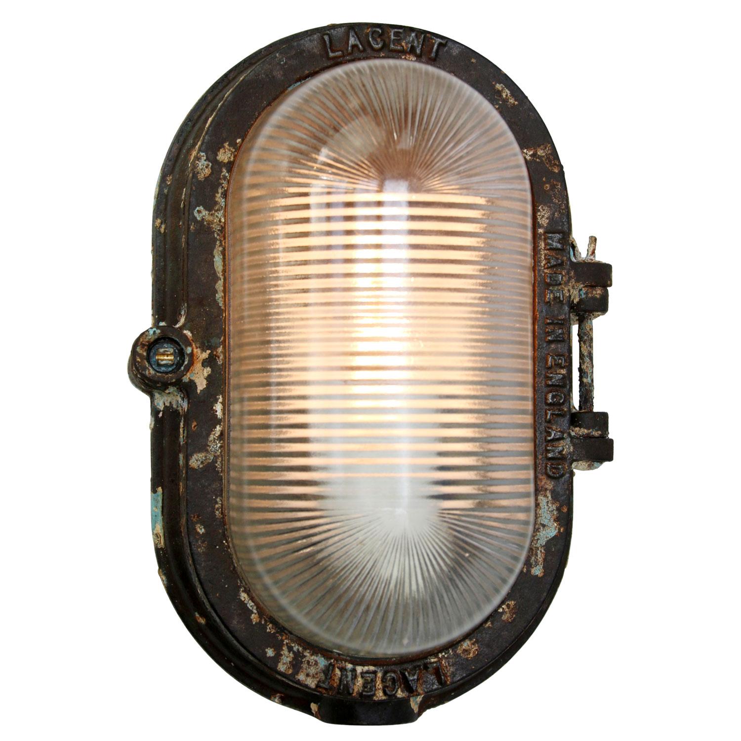 British Industrial wall/ceiling Classic
cast iron with striped glass 

Weight: 3.35 kg / 7.4 lb

Priced per individual item. All lamps have been made suitable by international standards for incandescent light bulbs, energy-efficient and LED