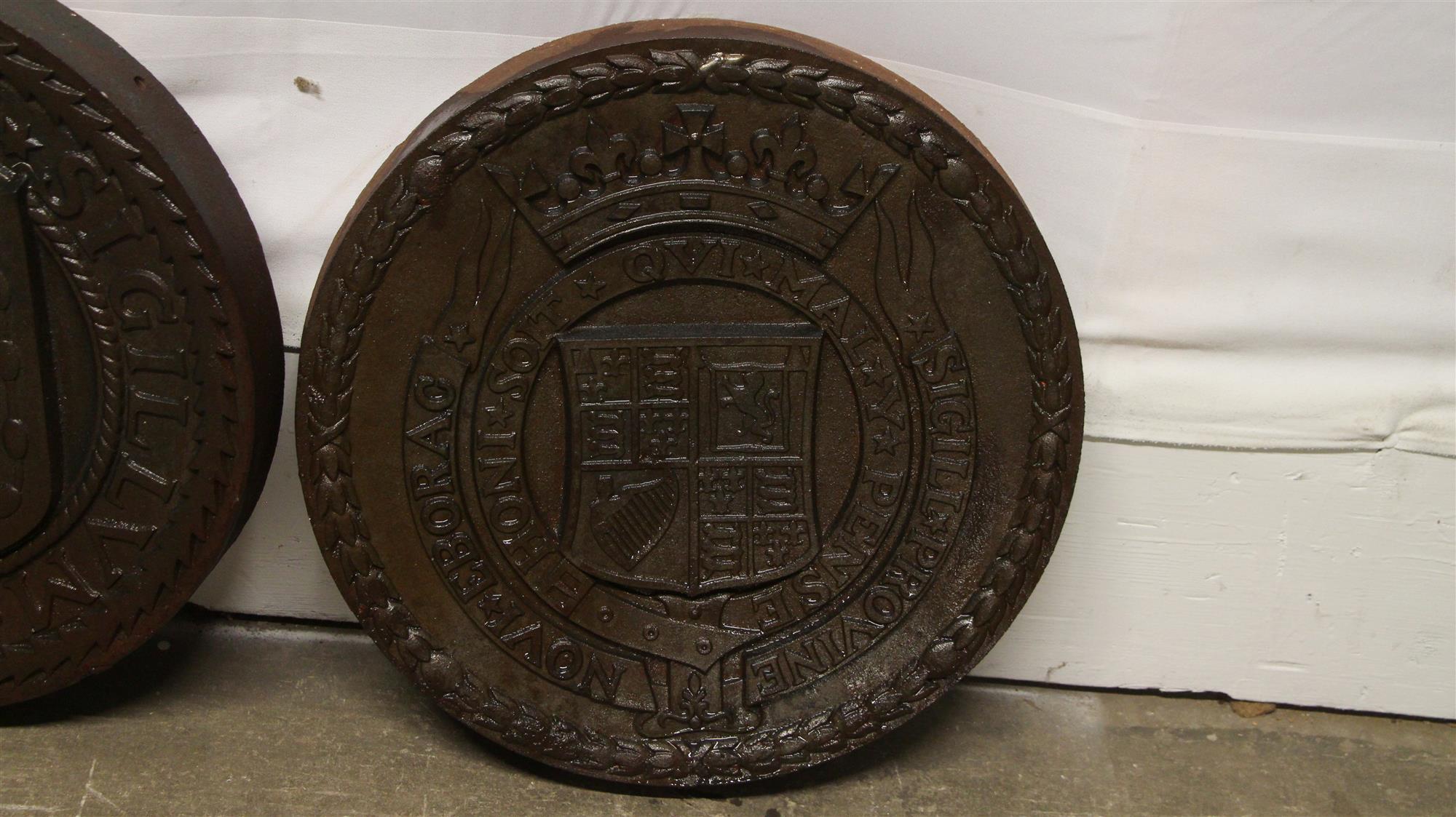 A complete set of 1931 elevated west side highway cast iron seals of different time periods of the City of New York City. Set consists of five large cast iron medallions designed by Rene Paul Chambellan (American, 1893-1955). Following from the New