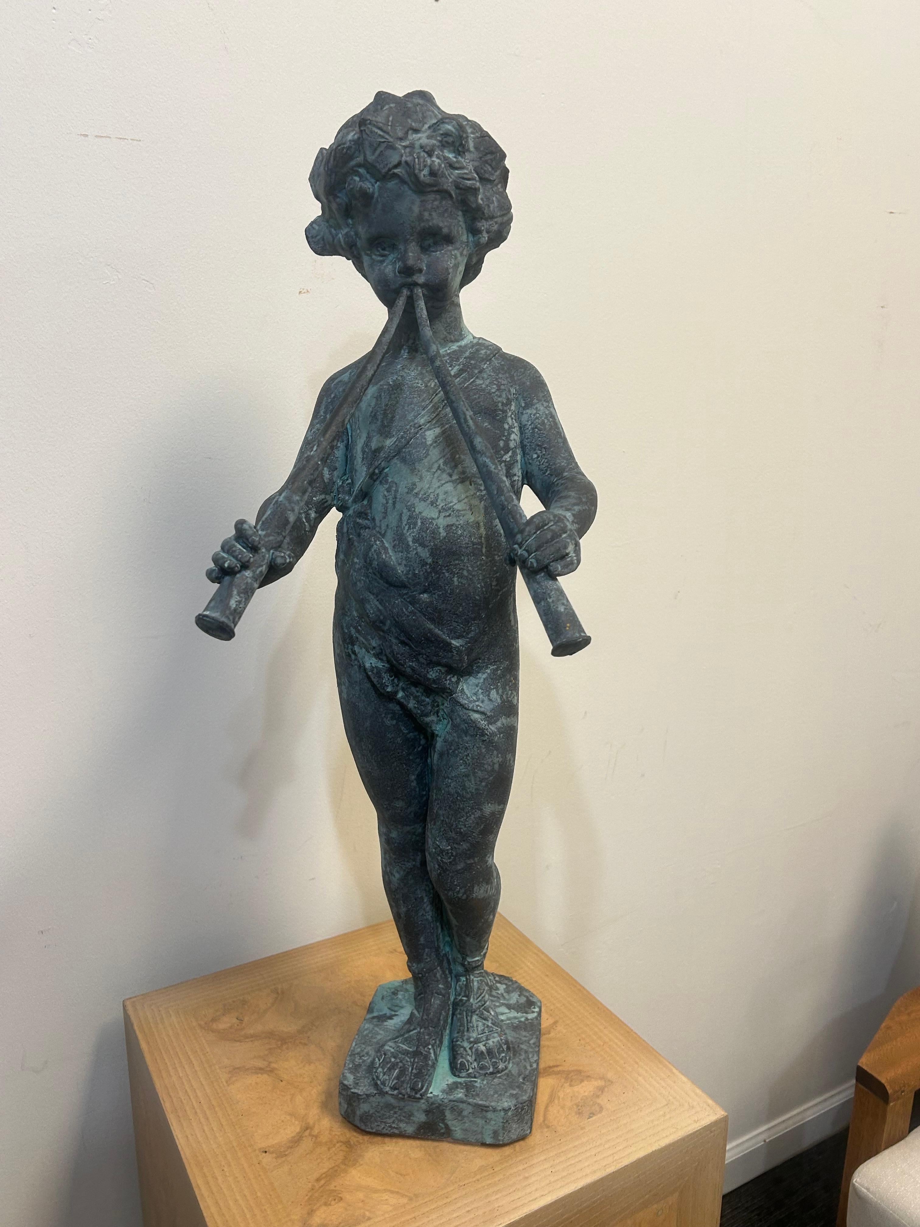 Cast lead garden statue of Pan as a young boy playing paired pipes In Good Condition For Sale In West Palm Beach, FL
