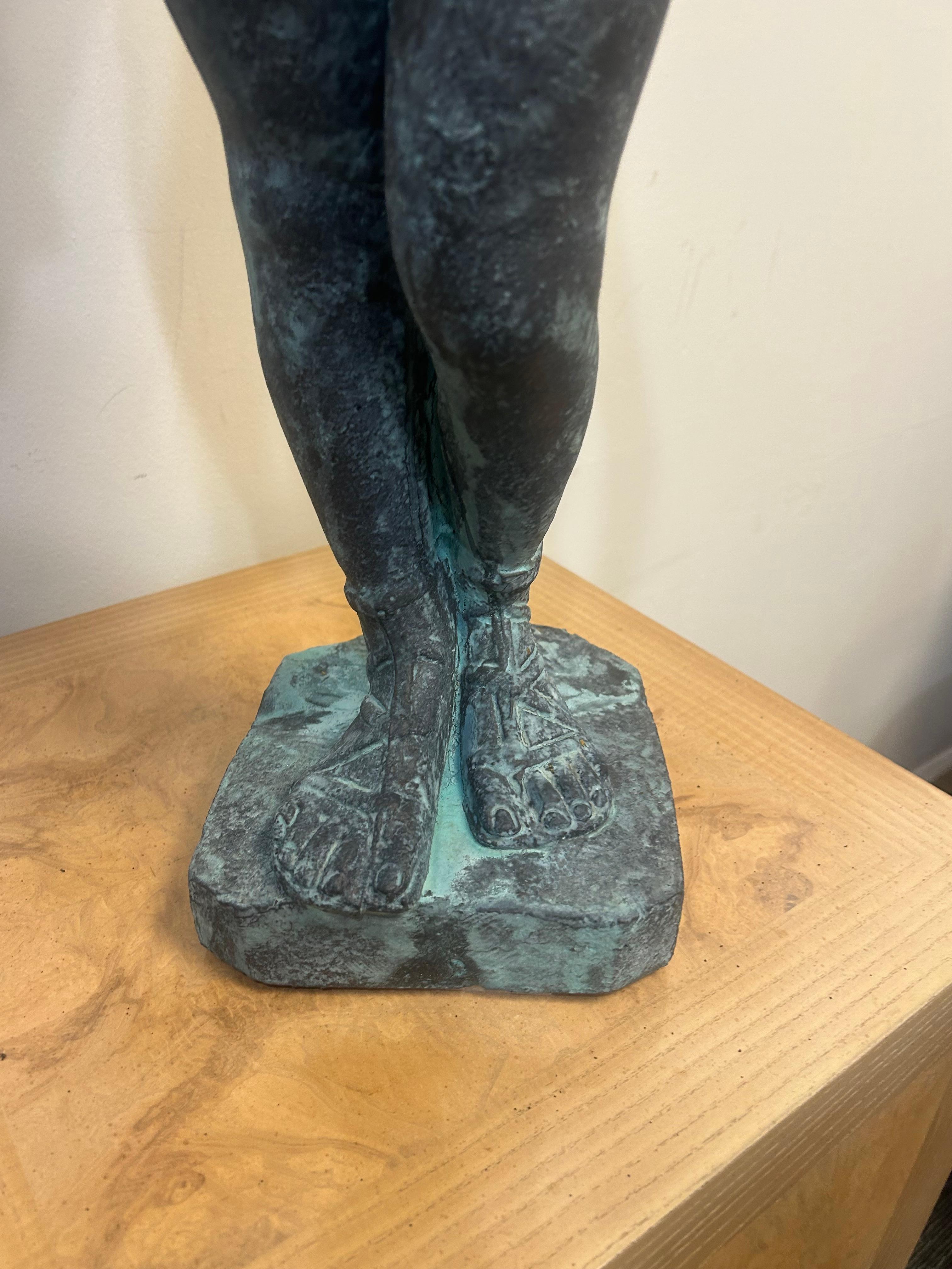 Mid-20th Century Cast lead garden statue of Pan as a young boy playing paired pipes For Sale