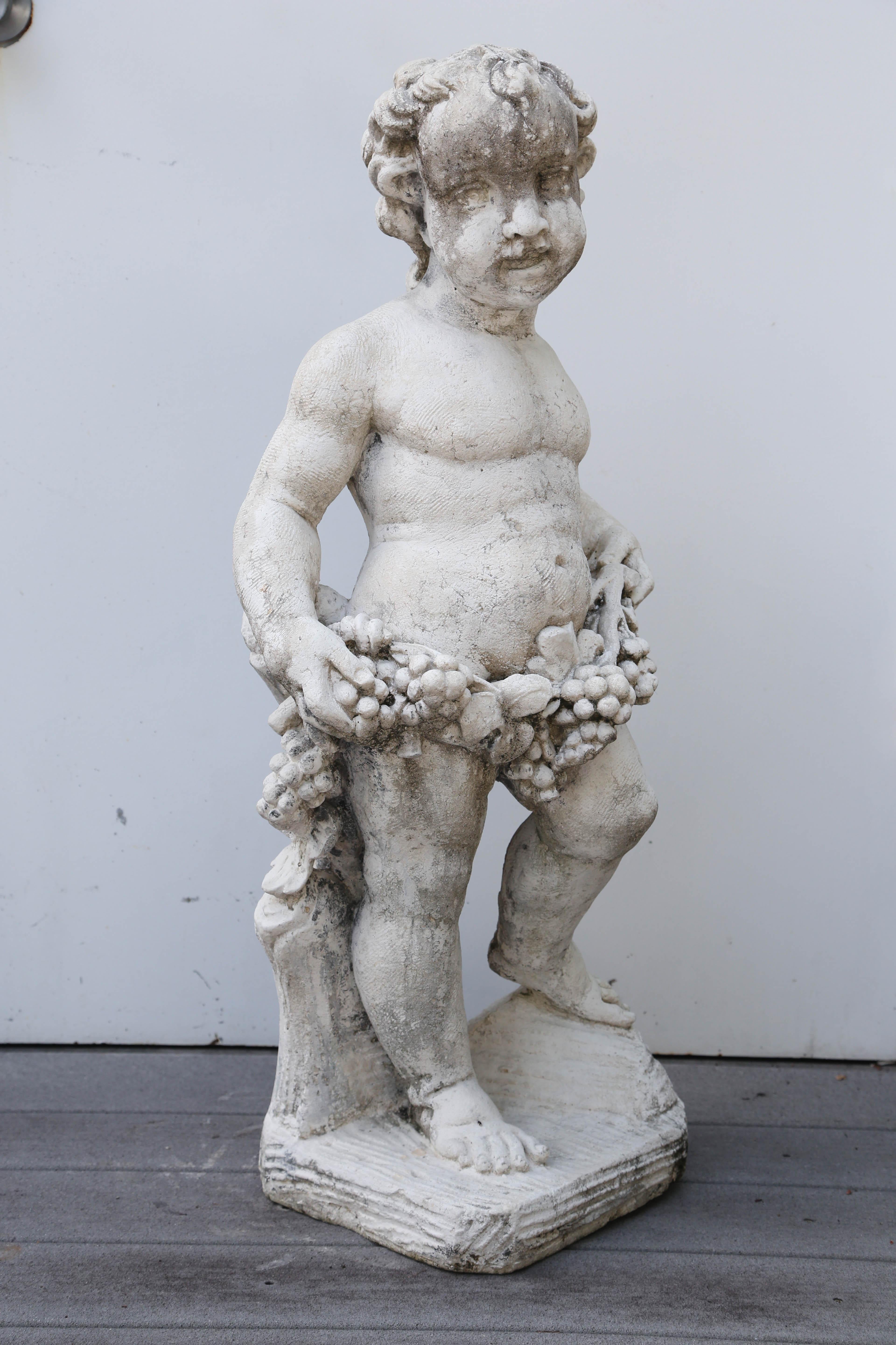 Charming single cherub garden statue.