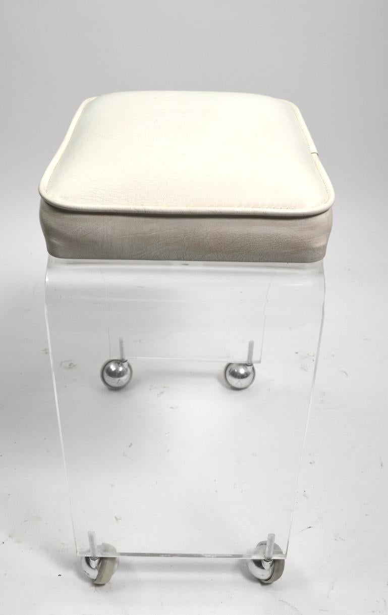 American Cast Lucite Waterfall Bench Stool  on Chrome Ball Caster Feet For Sale