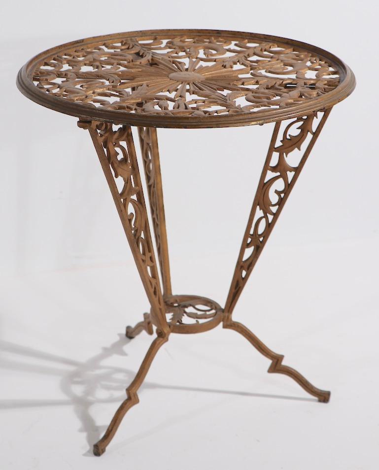 Rare and sought after Art Deco table made by Hagenauer for Rena Rosenthal. This classic table features stylized female figures on horses amid foliate as the top surface, on three dramatic angular legs, also having foliate castings. Great Jazz Age