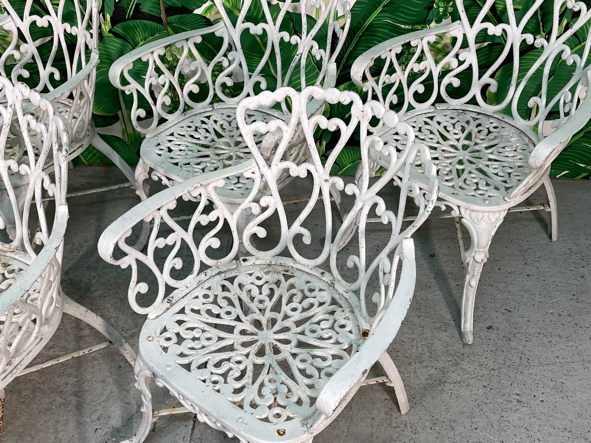 Large set of 8 cast aluminum garden/patio arm chairs in the manner of Frances Elkins. This design was created by Howitt Barry and his son Jack in Birmingham, Alabama in 1960. They were produced under the brand name 