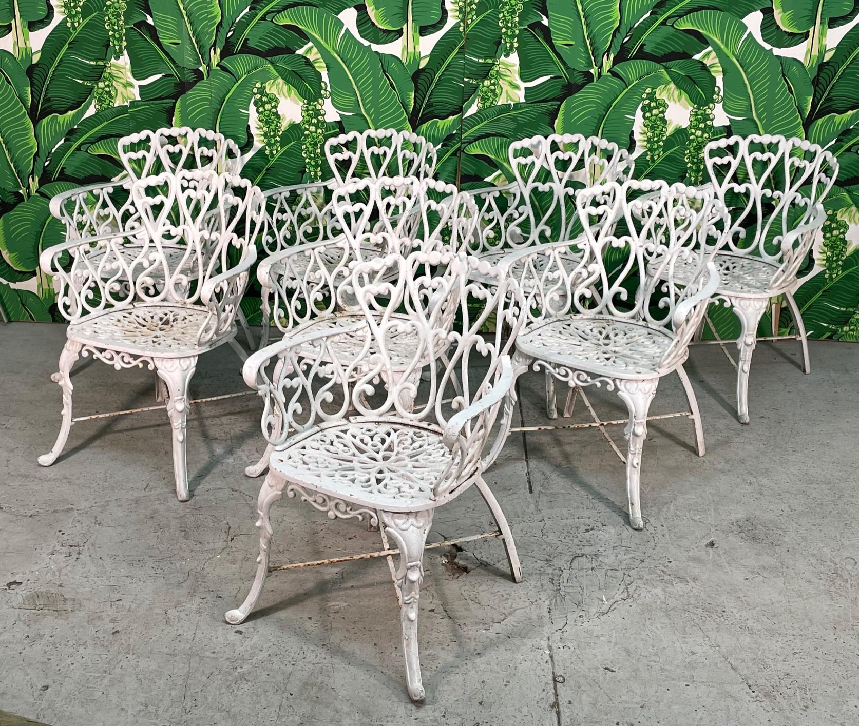 Large set of 8 cast aluminum garden/patio arm chairs in the manner of Frances Elkins. This design was created by Howitt Barry and his son Jack in Birmingham, Alabama in 1960. They were produced under the brand name 