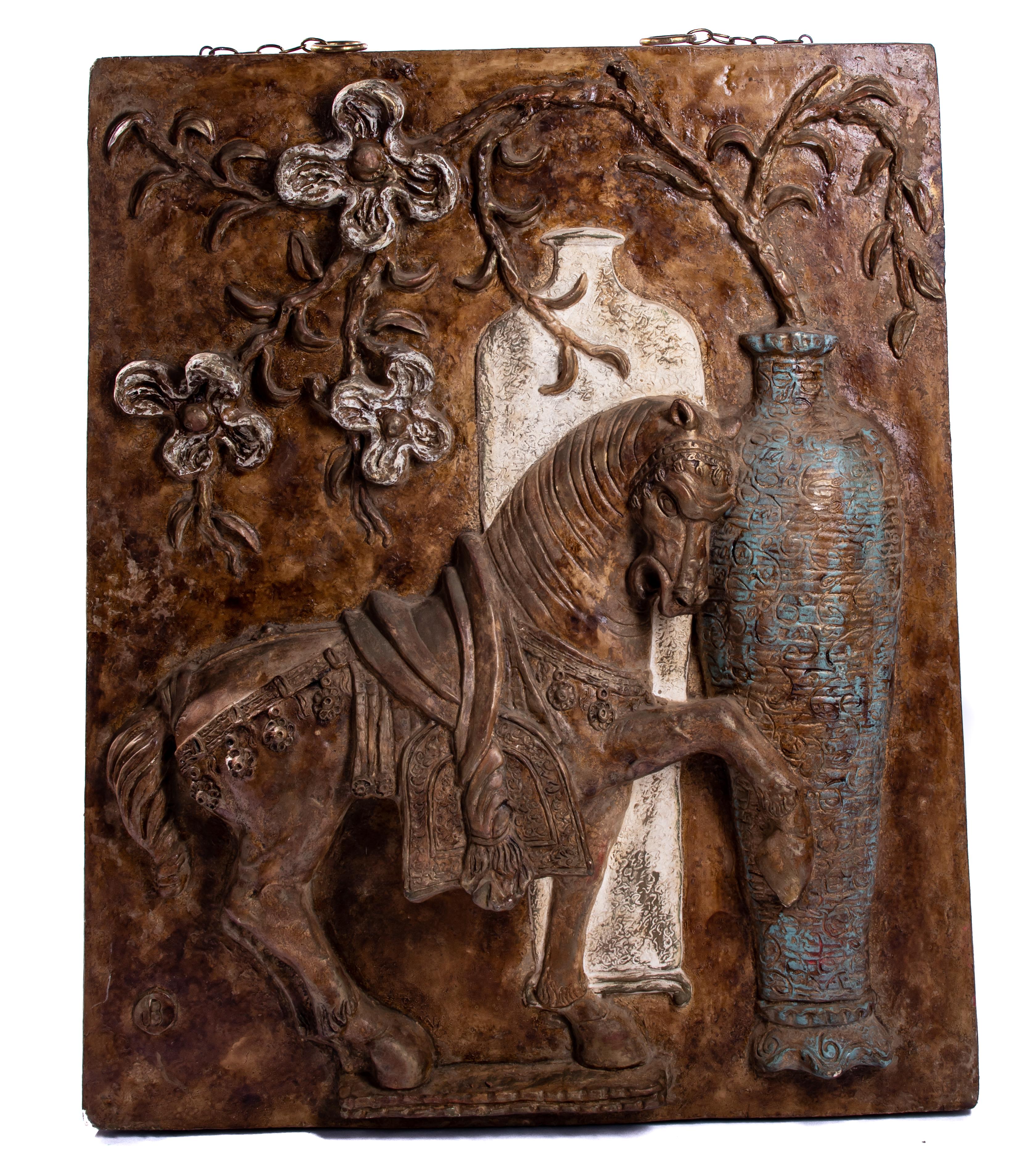 Offering this interesting fiberglass wall sculpture of a Tang horse with floral motif. The horse stands out in this piece as he is posed standing with one leg up. Next to him is a vessel that has florals coming out of it around him. It is marked in