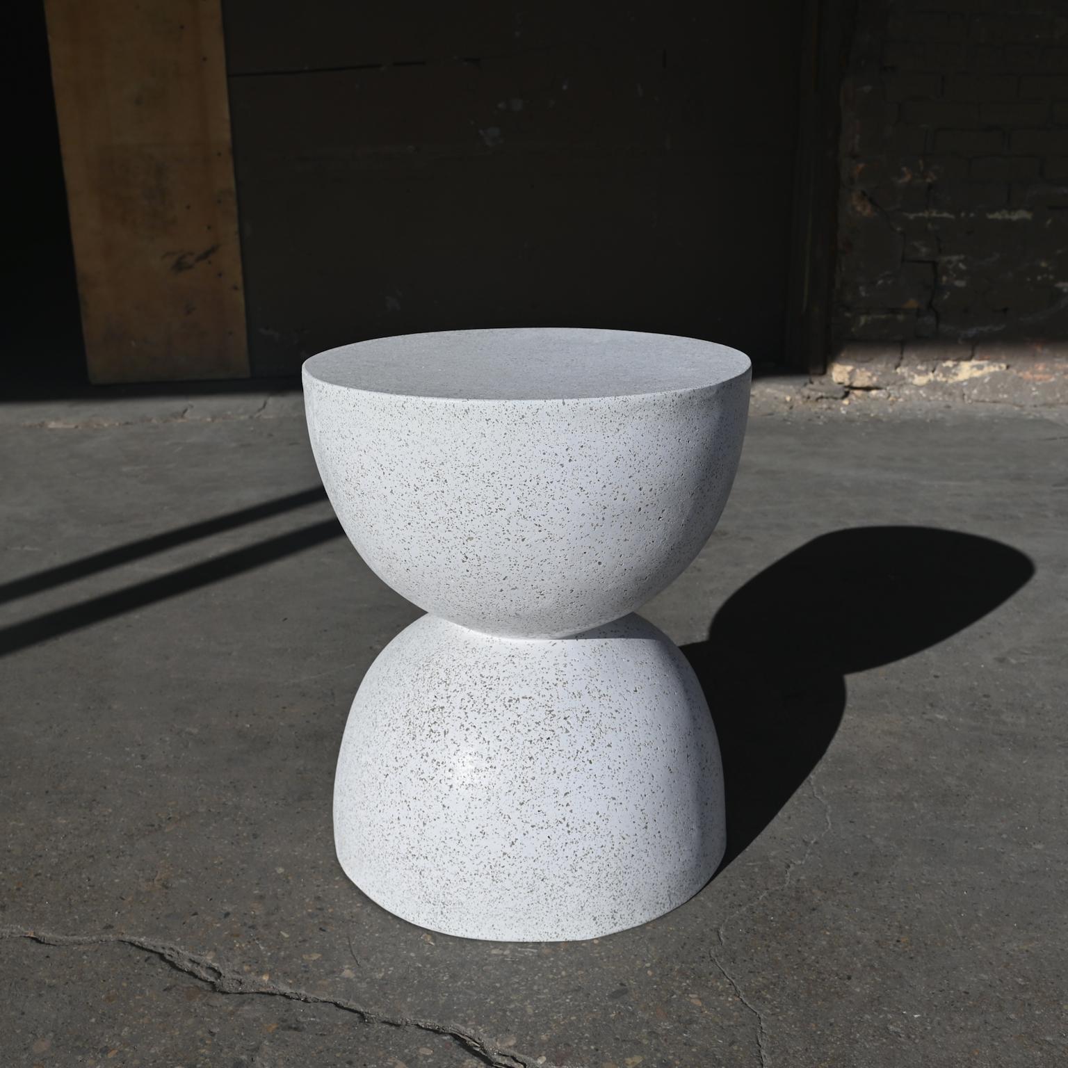 A symmetrical sculptural balance of elegance and function. 

Dimensions: Diameter 15 in. (38 cm), height 18 in. (46 cm). Weight 20 lbs. (9 kg).

Finish color options:
white stone
natural stone (shown)
aged stone
keystone
coal stone

Materials: