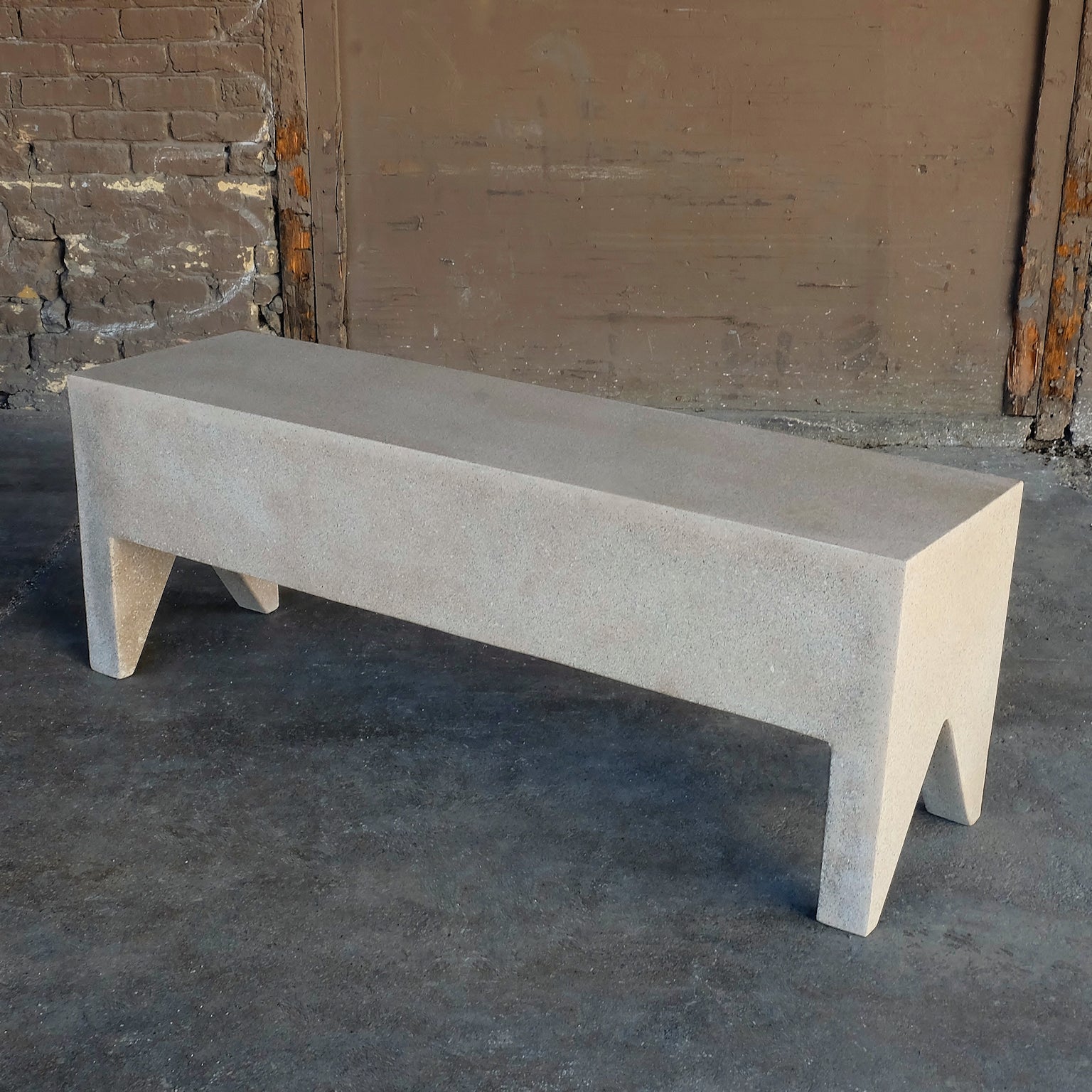 A hint of ornament. Americana at its Brutalist functional extreme.

Dimensions: Width 50 in. (127 cm), depth 14 in. (36 cm), height 18 in. (46 cm). Weight 45 lbs. (20 kg). No assembly required.

Finish color options:
white stone
natural