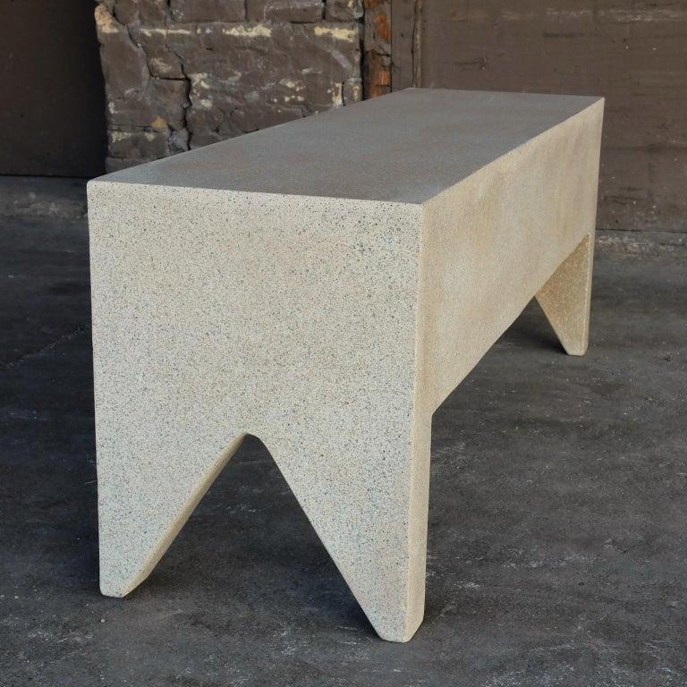 A hint of ornament. Americana at its brutalist functional extreme.

Dimensions: Width 50 in. (127 cm), depth 14 in. (35.5cm), height 18 in. (45.7 cm). Weight 45 lbs. (20.4 kg).

Materials: resin, stone aggregate, fiberglass.
Durable and designed to
