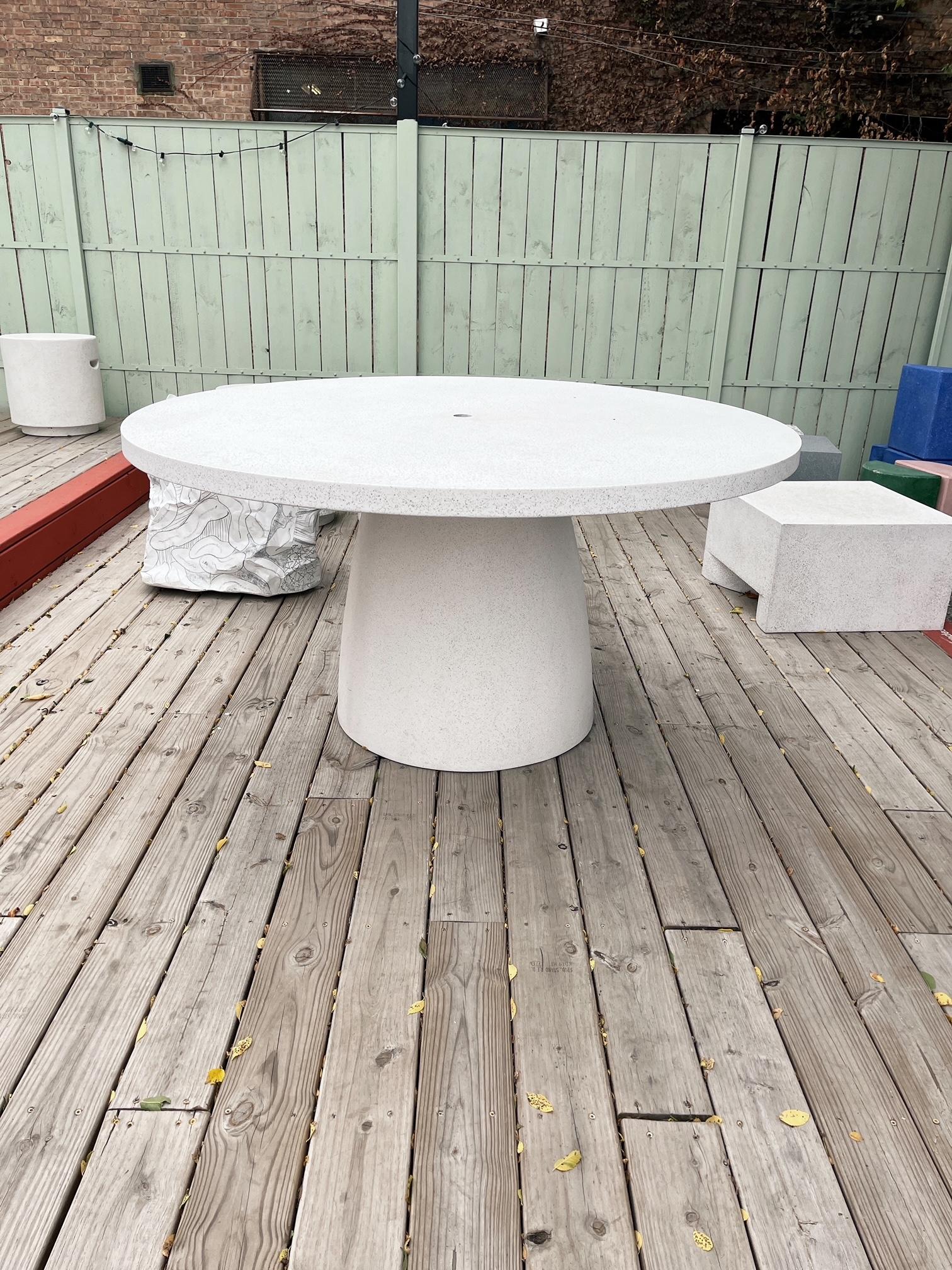 A gathering place of reunion. Passing plates around. Constant laughter and comfort. The bedrock of family.

Dimensions: Diameter 60 in. (132 cm), height 29 in. (73.6 cm). Weight 130 lbs. (54 kg) Includes umbrella hole.

Finish color