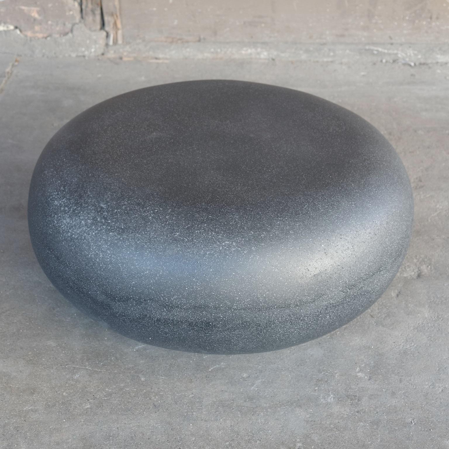 Like a stone from a stream, smoothed for millennia by the passing currents. The fluid potential of natural power emanates from its presence.

Dimensions: Diameter 36 in. (91 cm), height 15 in. (38 cm). Weight 30 lbs. (14 kg).

Finish color