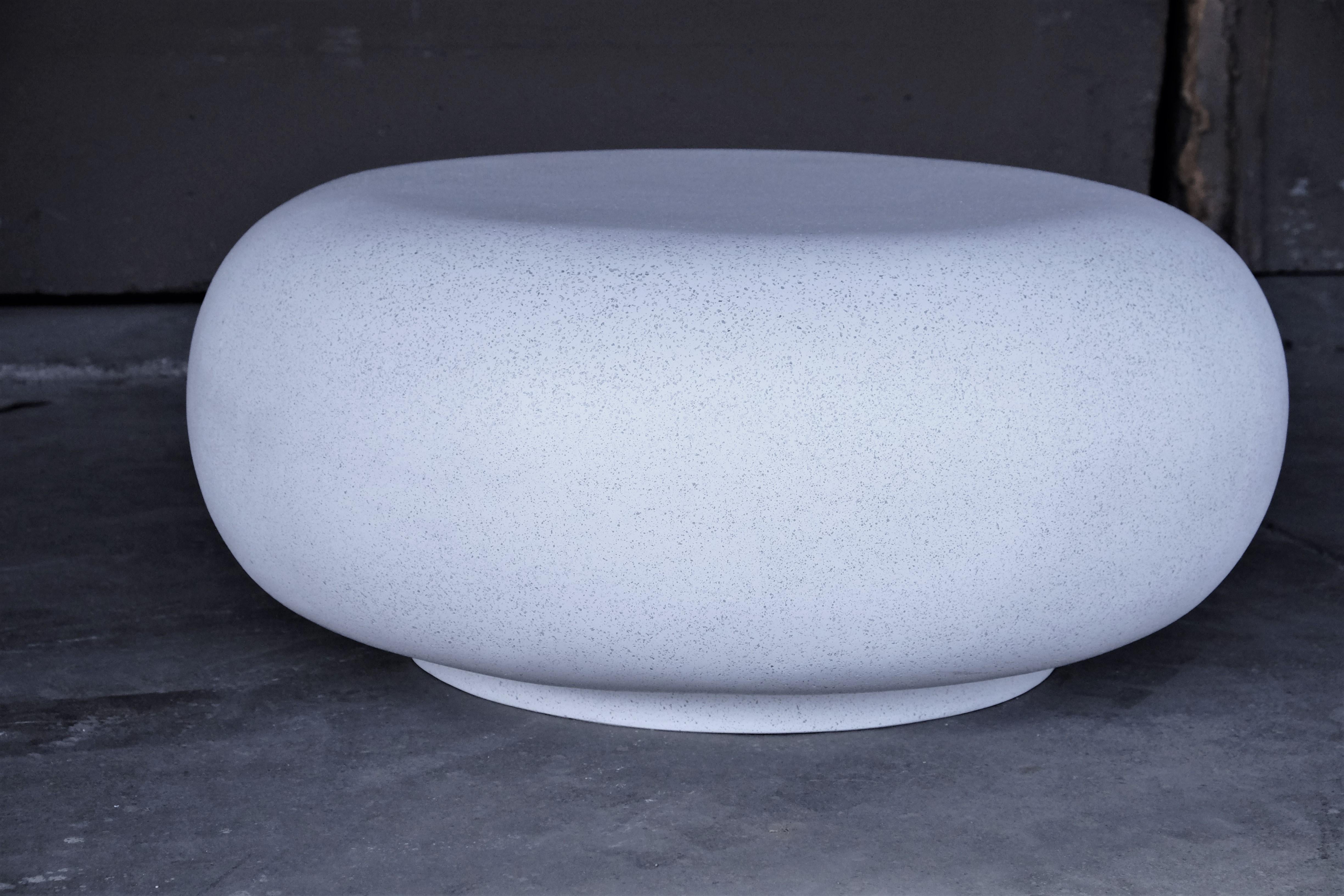 The Pebble table is an elegant cocktail table with an organic form. Pictured in our white stone finish, the texture and modern look of concrete make it appropriate for a wide variety of styles and spaces.

Dimensions: Diameter 36 in. (91 cm), height