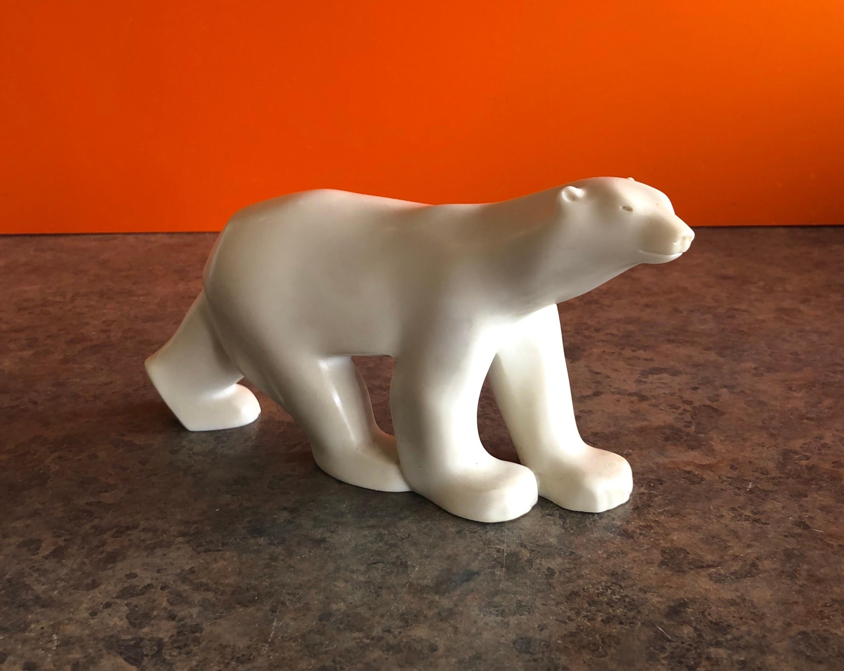 Cast resin polar bear sculpture by Francois Pompon for the MOMA Collection, circa 1984. The piece is a minature reproduction of the famous work by Pompon and is stamped 