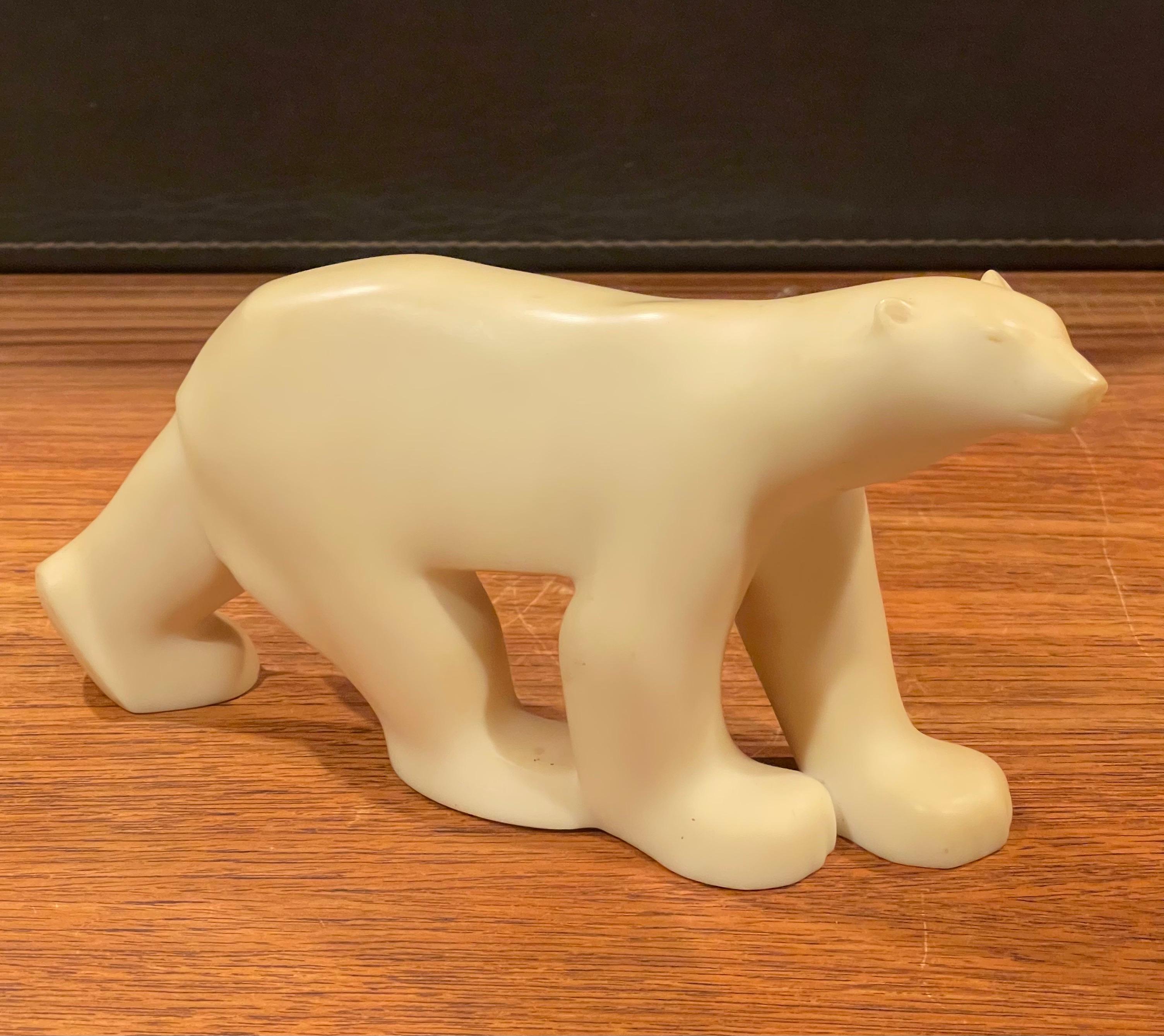 Cast resin polar bear sculpture by Francois Pompon for the MOMA Collection, circa 1980s. The piece is a minature reproduction of the famous work by Pompon and is in good vintage condition. #2060.