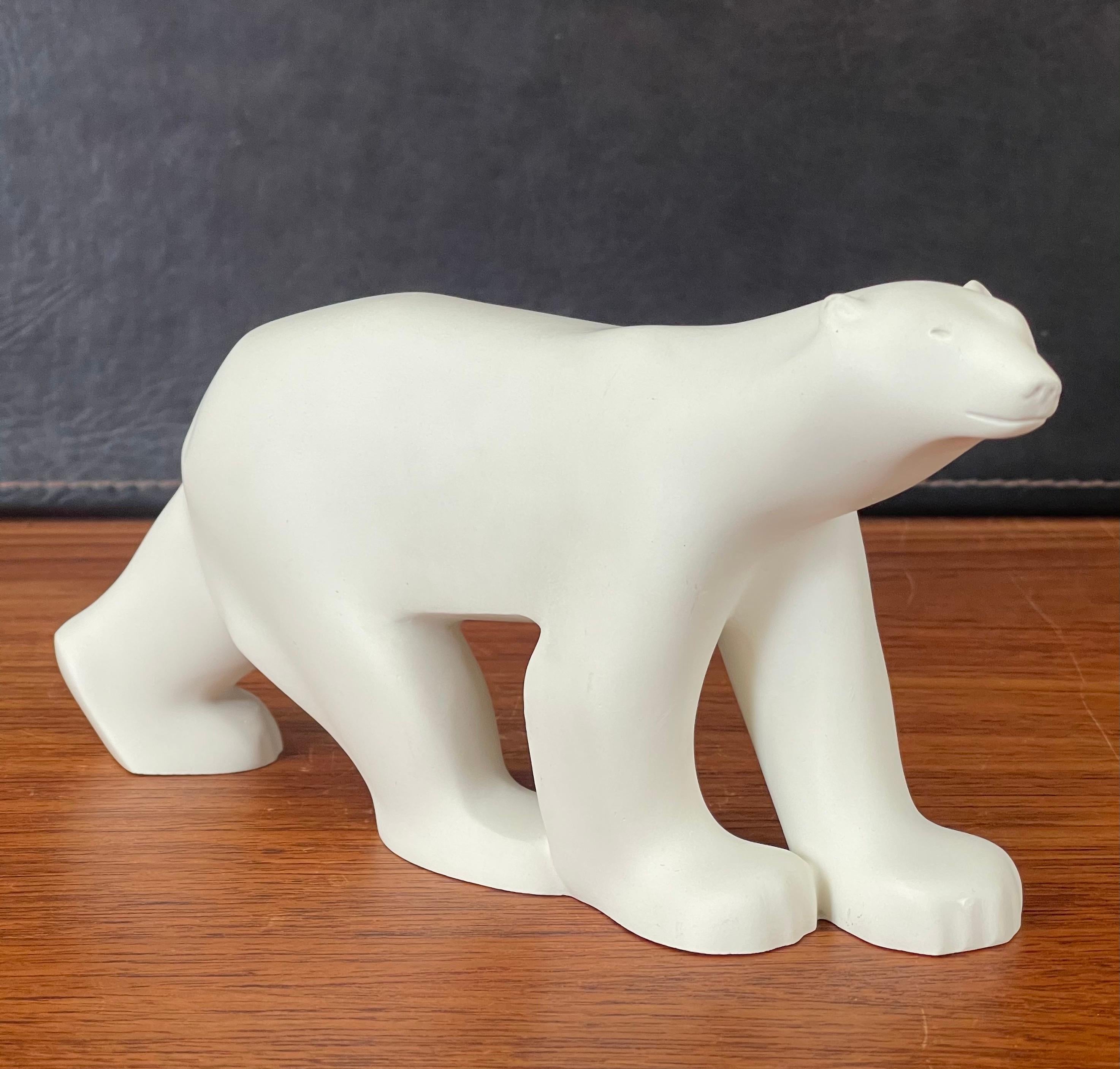 Cast resin polar bear sculpture by Francois Pompon for the MOMA Collection, circa 2000s. The piece is a minature reproduction of the famous work by Pompon and is in very good condition. #2076.