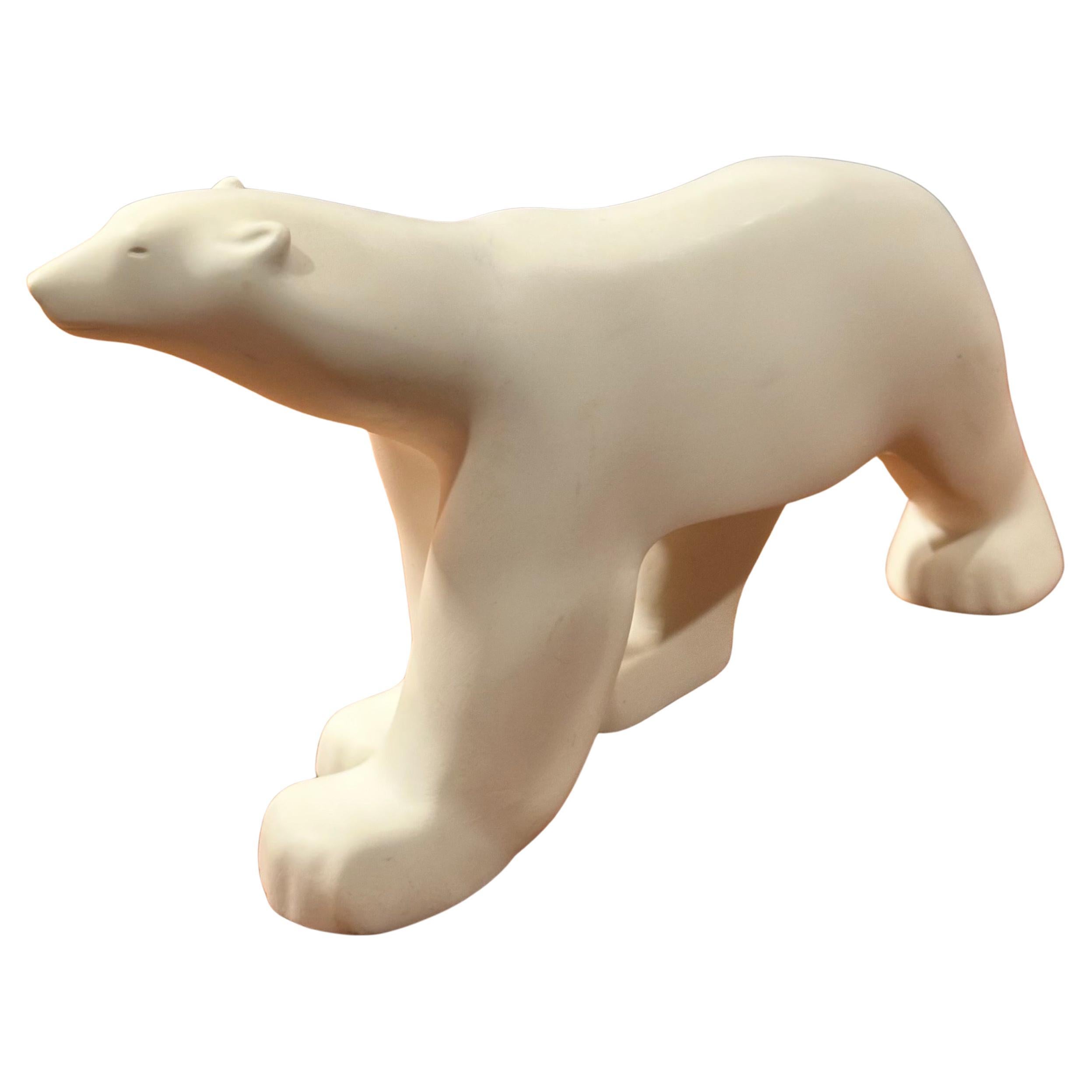 Cast resin polar bear sculpture by Francois Pompon for the MOMA Collection, circa 1984. The piece is a miniature reproduction of the famous work by Pompon; it measures 9