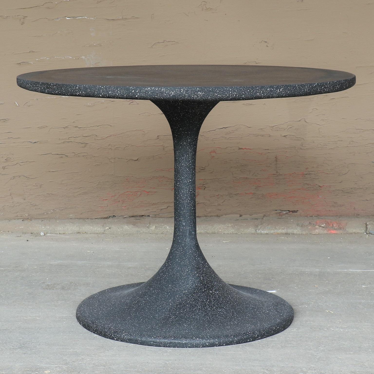 An unlikely material takes on an iconic form. Strength and durability, sculpted with fragility and elegance. Form and function in one. 

Dimensions: Diameter 30 in. (76.2 cm), height 23 in. (58.4 cm). Weight 40 lbs. (18 kg).

Finish color