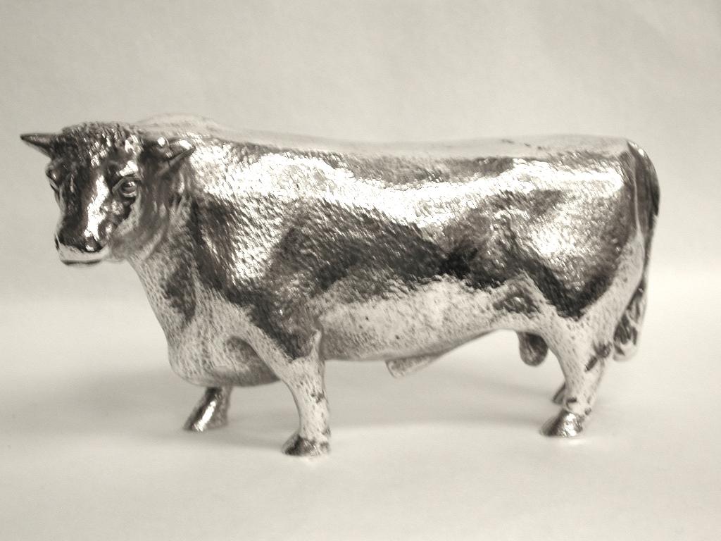 Superb silver plated model of a bull.
This realistic miniature bull is cast in the same way as a silver one.
  