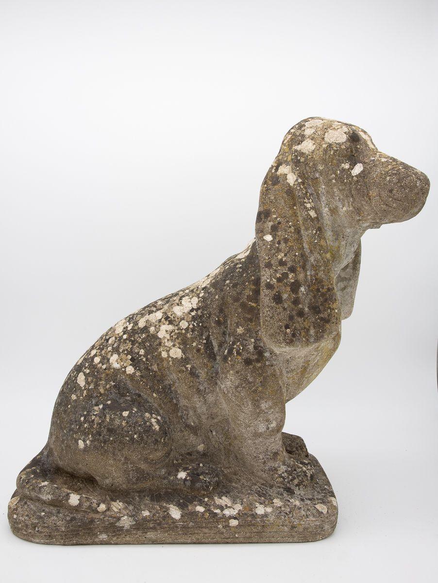 A beautifully patinated hound dog garden ornament. Maintaining its original form with minor losses, the highly desirable patina has given this hound lovely green elements.
