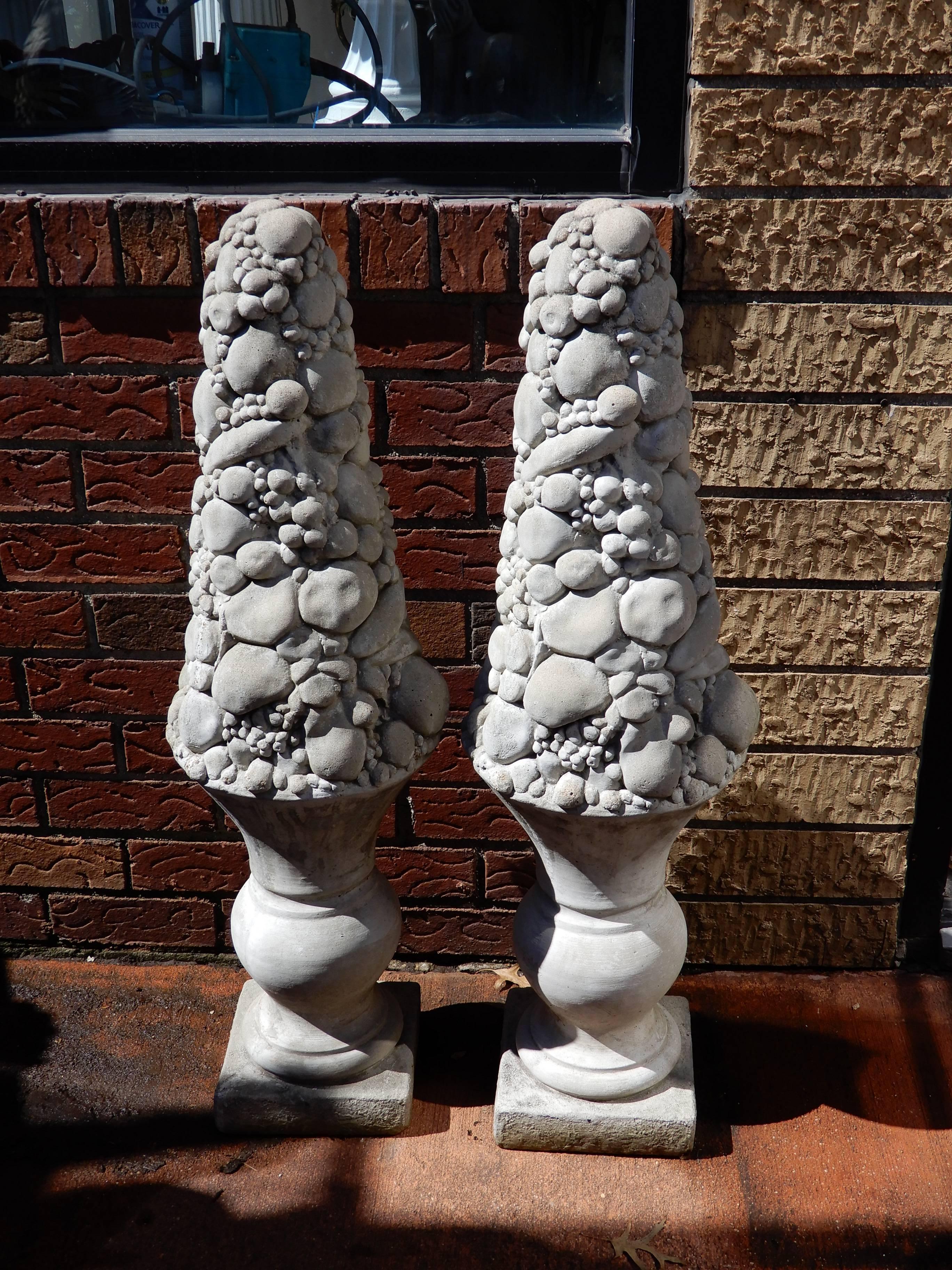 A fruit carved cast stone column or topiaries. The body of the Topiaries carved with fruit.
These were usually placed at the entry doors to homes in the mid-20th century.