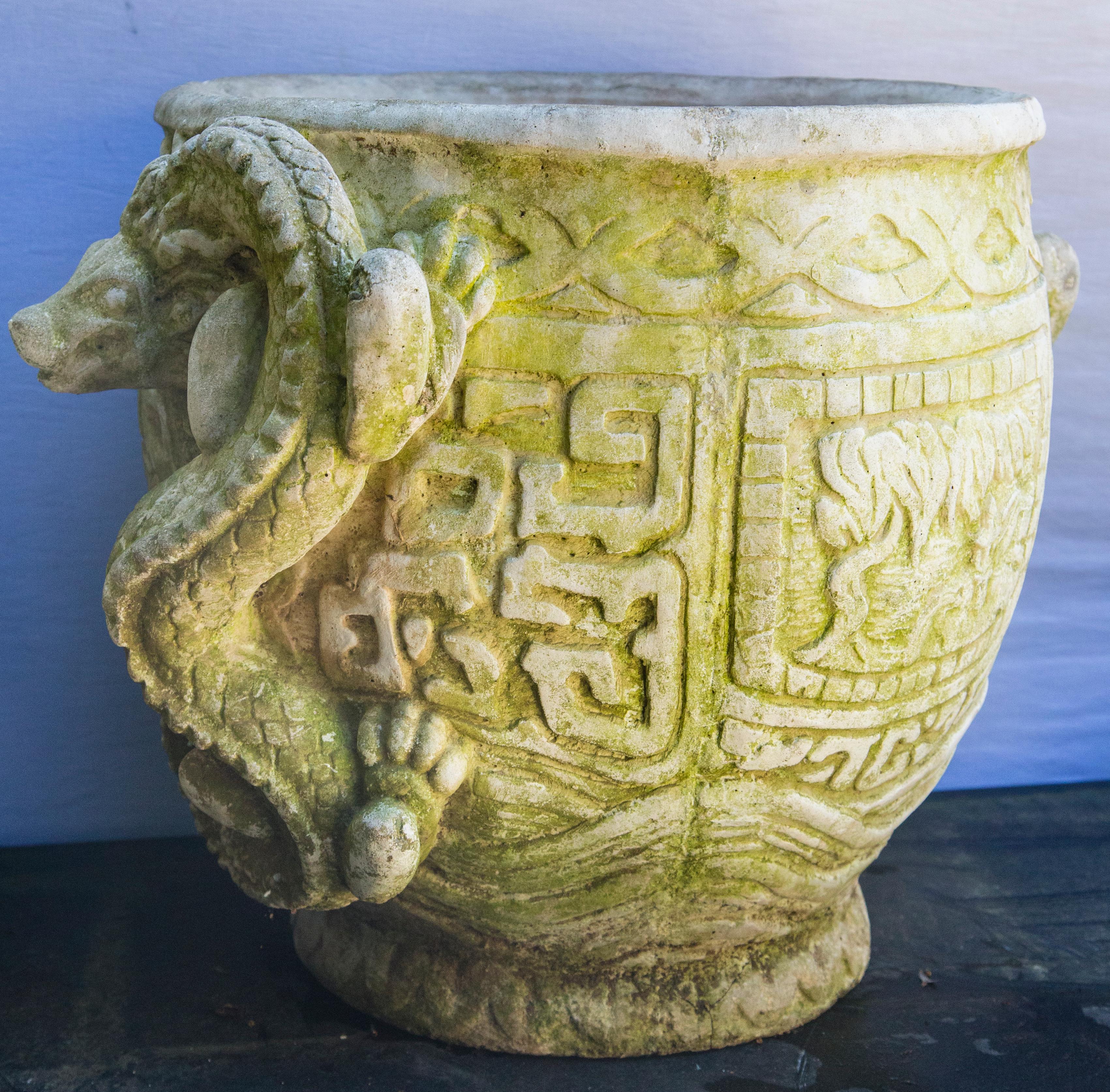 Distressed surfaces. Two dragons swirl on the outside of the pots, against a background of Chinese characters. Rolled rim. Though photos show 2 planters, there in only one.

The planting area has a 13 inch diameter and is 14 inches deep.
 