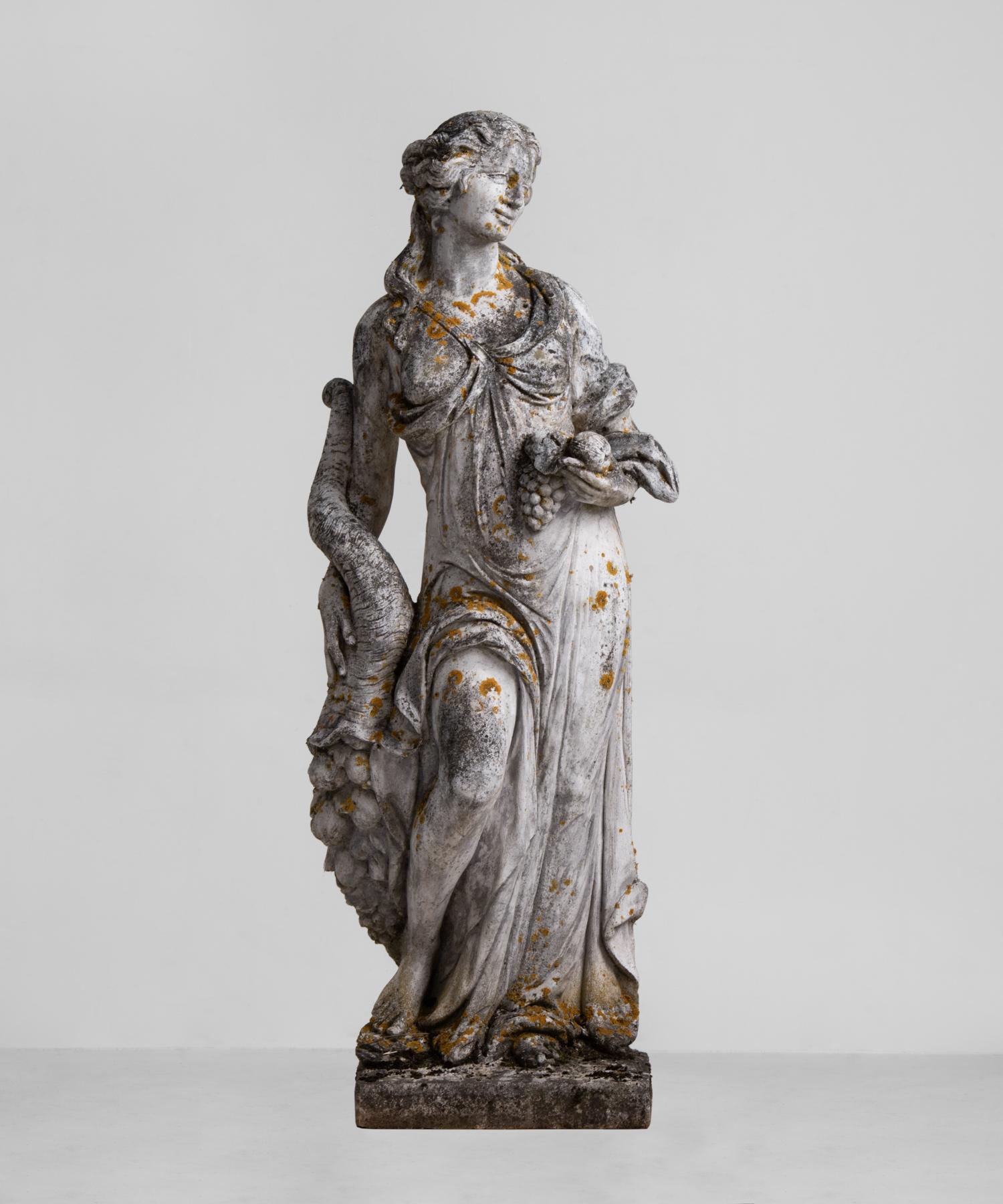 Cast stone garden statue of Demeter, England, circa 1950.

Larger than life composite stone sculpture of the goddess Demeter, with amazing patina.