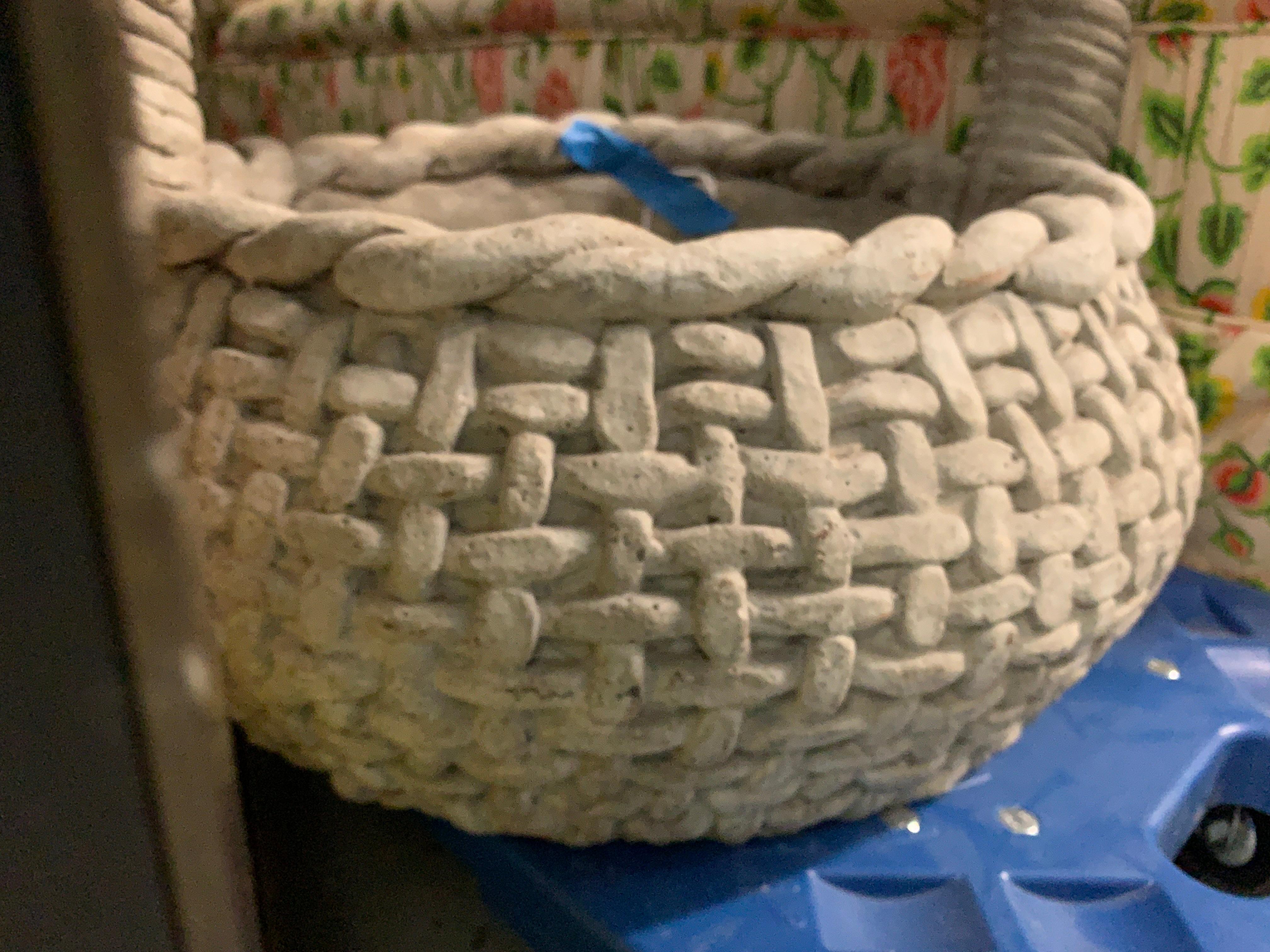 Large cast stone woven basket garden planter, with a twist handle. Adorable trompe l'oeil basket weave surface. 

Measures: 18