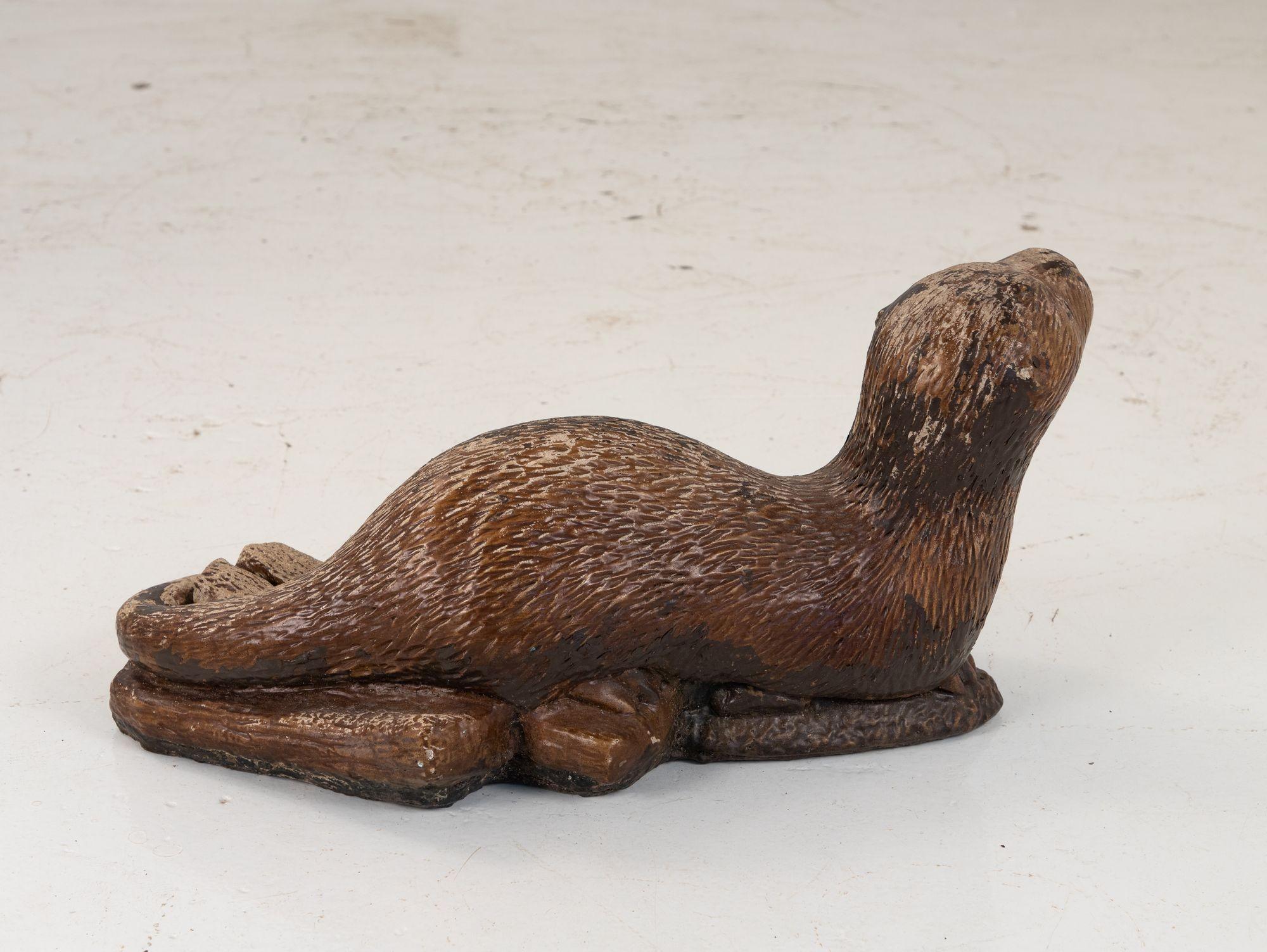 otter with stone