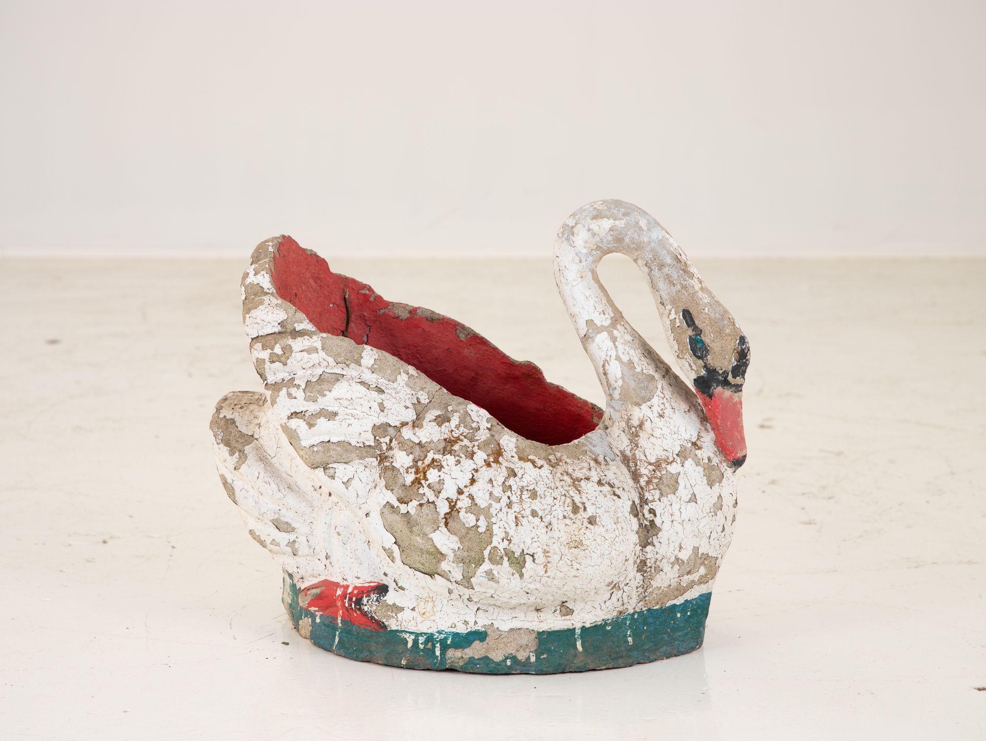 Mid 20th century French painted stone swan planter. Retaining much of the original paint, the planter is in good condition with wear consistent with age and use.