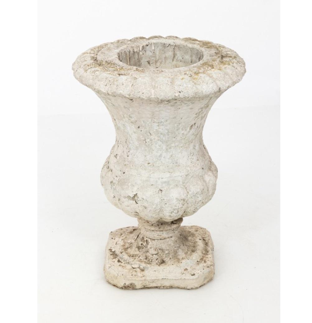 Monumental stone garden architectural pot in a classical urn shape made in the early 20th century. This traditional garden element is ideal for elevating greenery for a striking landscape. Nice weathered surface to the antique white finish. Multiple