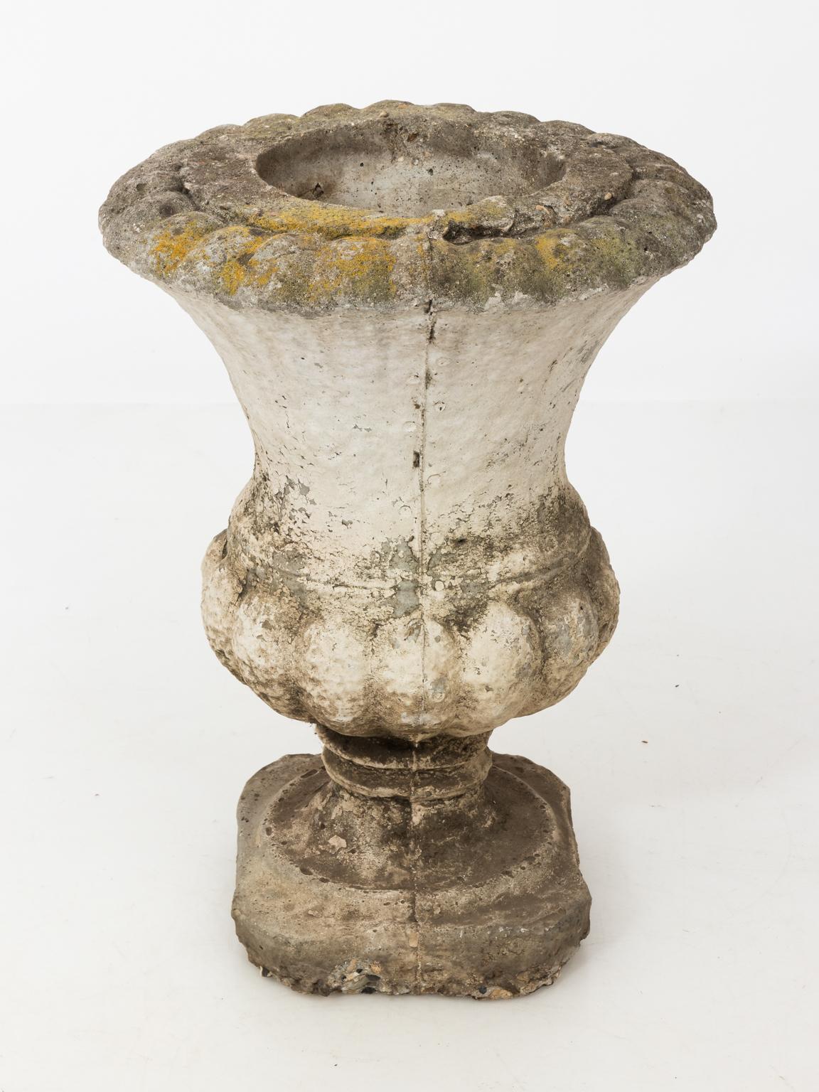 Cast stone ornamental garden urn with faux finish, circa 20th century. This piece weighs between 40 and 70 LBS.
 