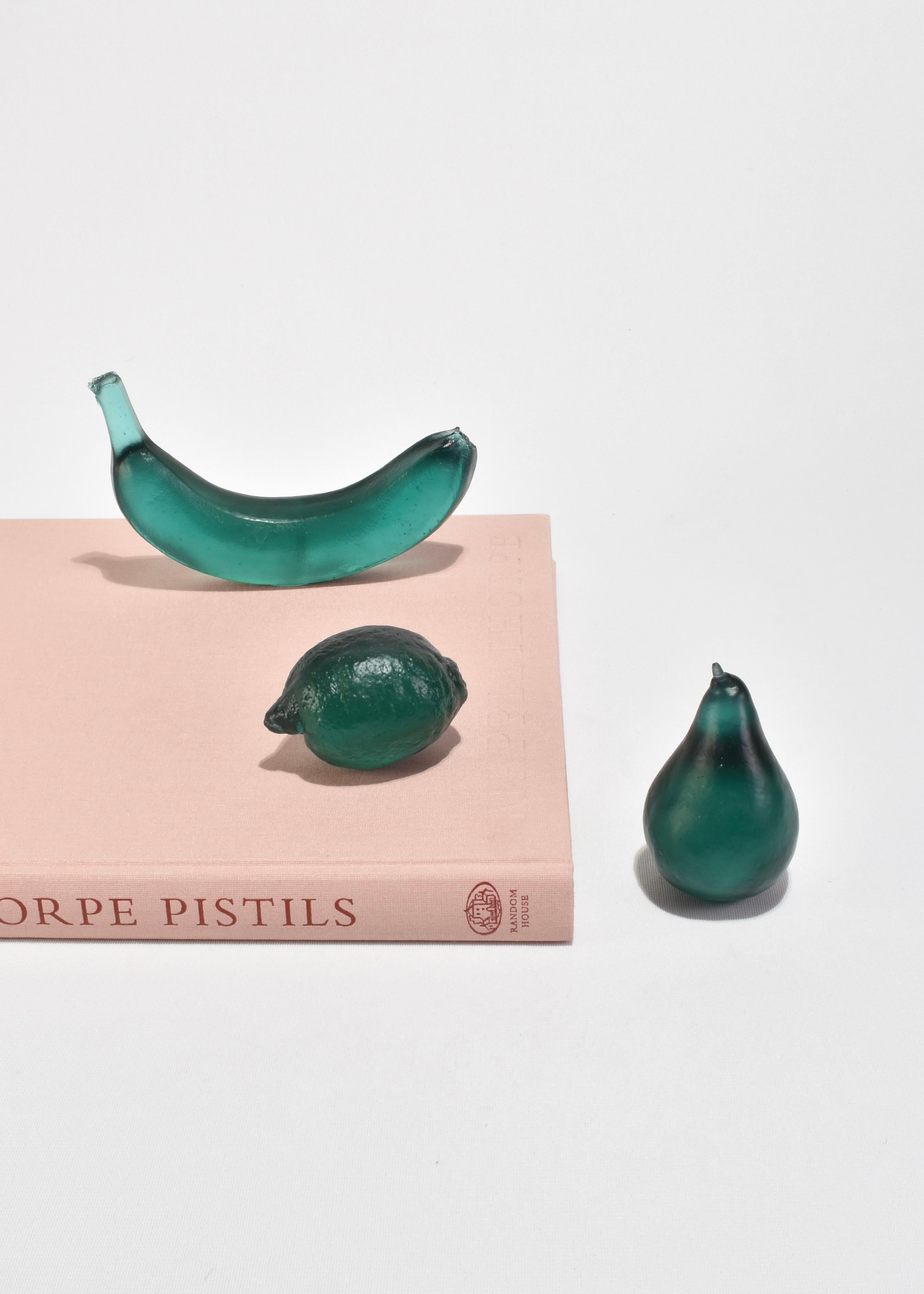 Sculptural glass banana, handmade in Auckland, New Zealand by artist Devyn Ormsby. Individually cast from a true to size banana into a solid, crystal glass form.

The banana shape stands on its own drawing in and reflecting light due to the unique