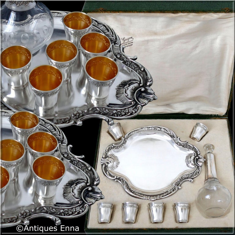 Art Deco period for this French silver plated liquor set 8-pieces. The set includes a silver plated and cut glass decanter, six silver plated liquor cups and original silver plated tray. This complete set is with its original case with compartments