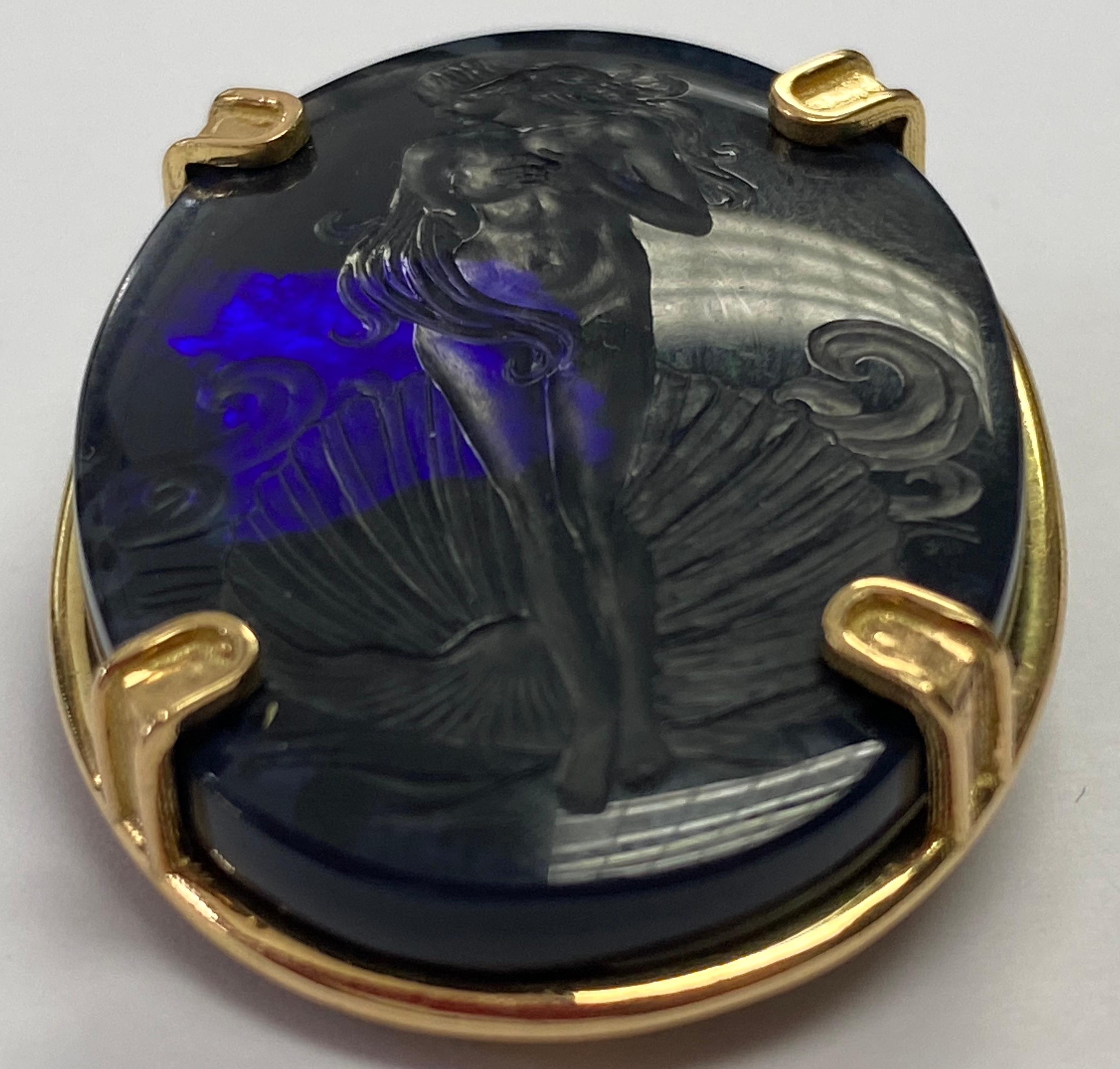 Castellani® commissioned to have this distinctive 42.06ct Natural Black Opal hand carved into an intaglio.
The subject is “Venus Rising Out of the Sea”,the same scene that the famous artist Botticelli painted in circa 1485. The intaglio is very