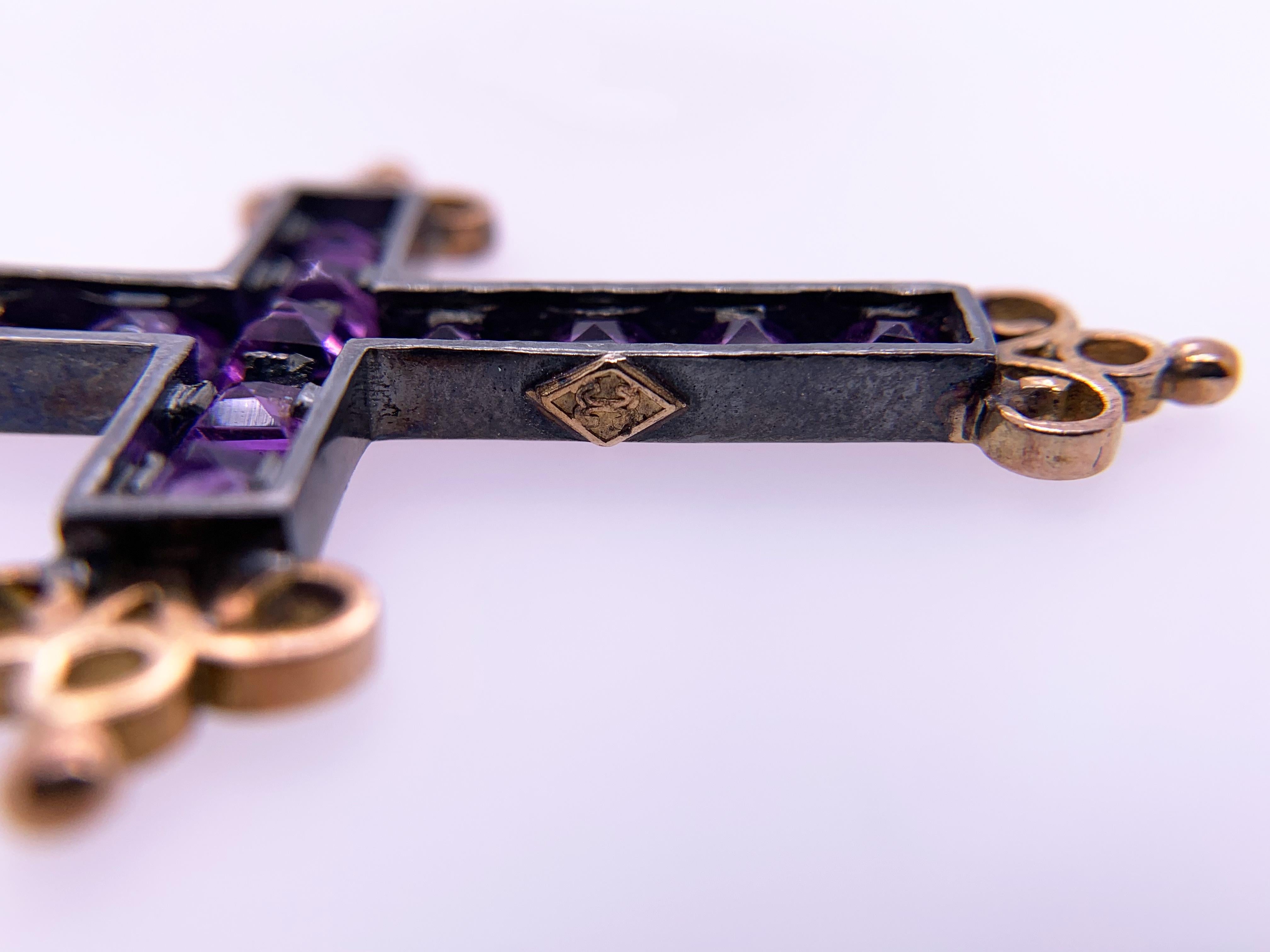 Amethyst Diamond Cross Pendant with Eleven square 4mm amethyst set individually. The amethyst are set into oxidized silver. The18kt oxidized yellow gold scrolls at the ends are a nice color contrast between the oxidized silver and gold. The bale is