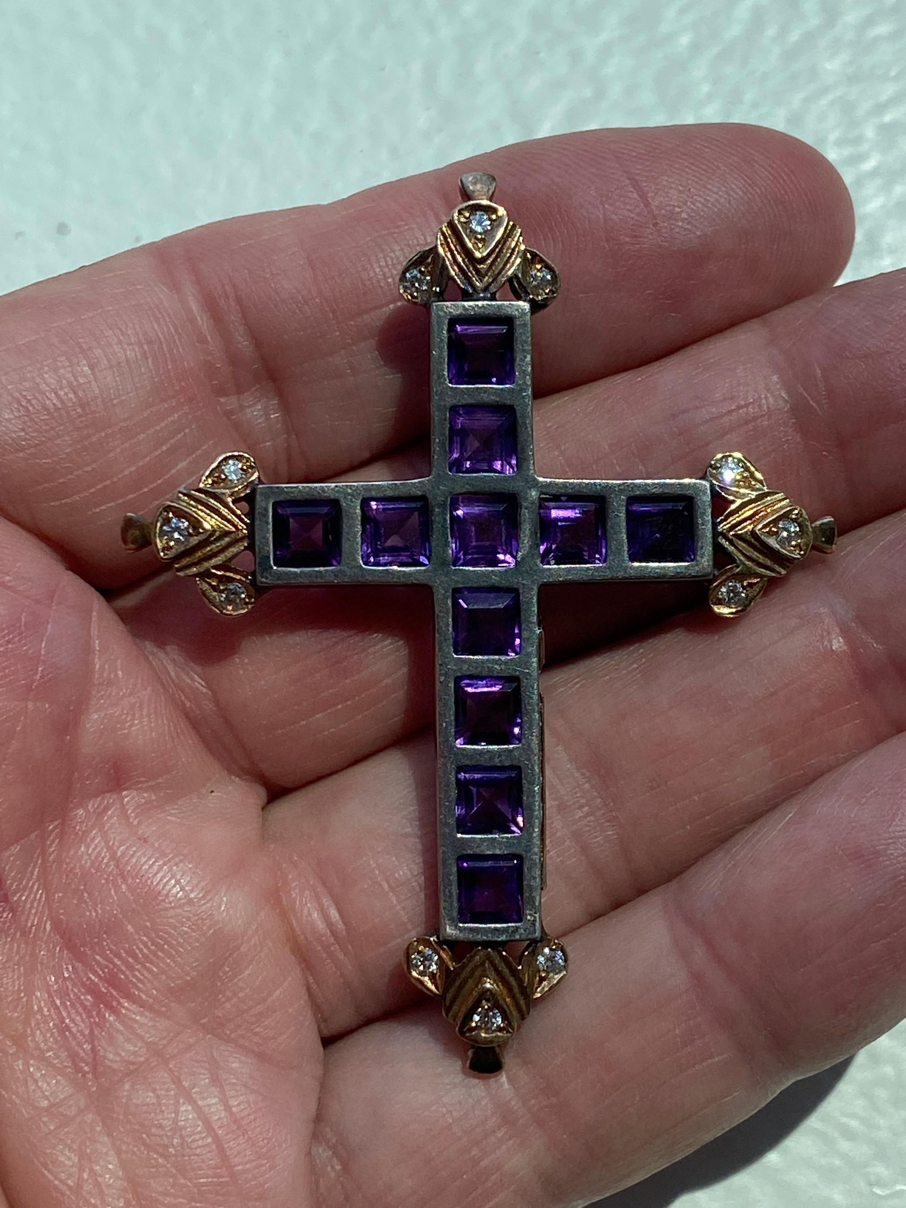 Amethyst and Diamond Cross Pendant with Eleven square 5mm amethyst set individually. There are 12 round diamonds weighing 1/3ct  color: H and clarity VS1. The amethyst are set into oxidized silver and the diamonds into 18kt oxidized 18kt yellow