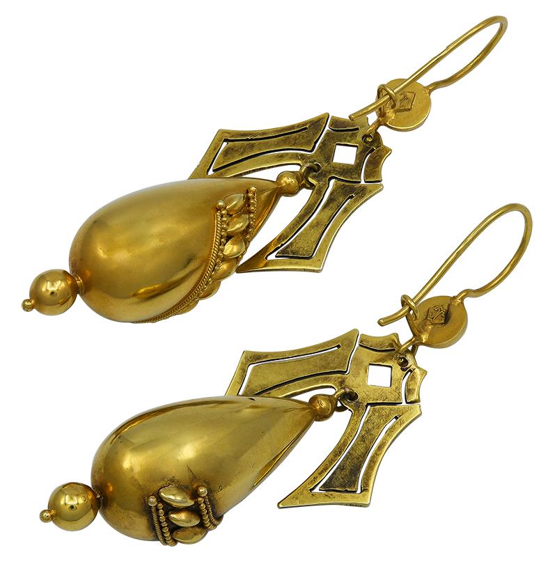 Handsome Etruscan Revival 15kt yellow gold hollowform drop earrings on wires, decorated with granulation and lentil motifs, bearing maker's marks for Castellani. The earrings measure app. 2 1/2 inches long by 7/8 inch wide (at widest point),