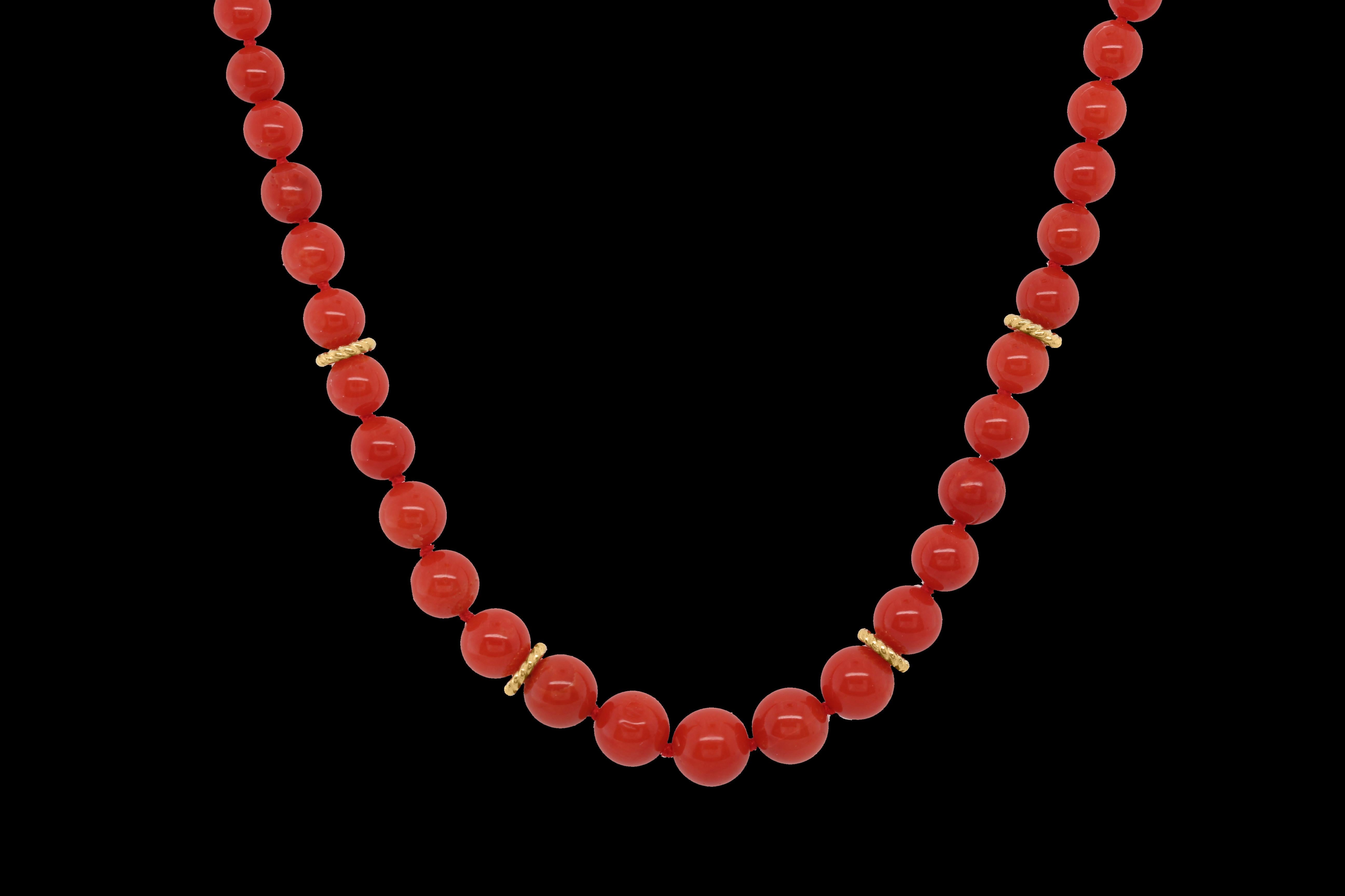 Bright Orange Coral beads measure 6.77mm at the center and graduate to 3.29mm at the clasp (91 coral beads in total). There are 4 gold braided spacers in the front of the necklace. The Castellani® signature clasp and gold braided spacers are in our