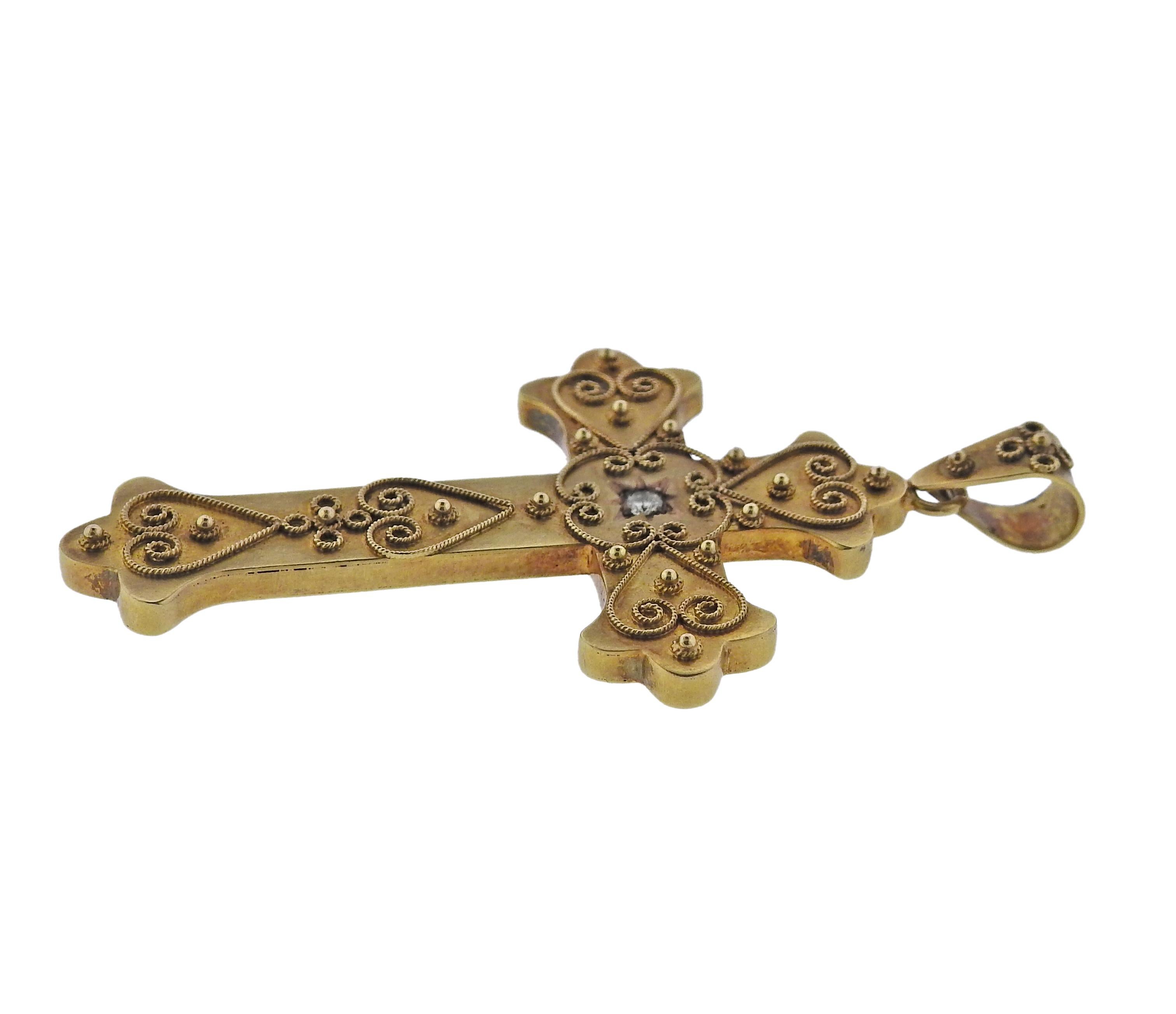 The jewelry offered by Castellani today, is created by the same gold techniques as in the 1850’s as well as by the ancient Etruscans. This 15k gold Castellani cross pendant featuring filigree design and a 0.05ct VS/H diamond.  Pendant is 55mm x