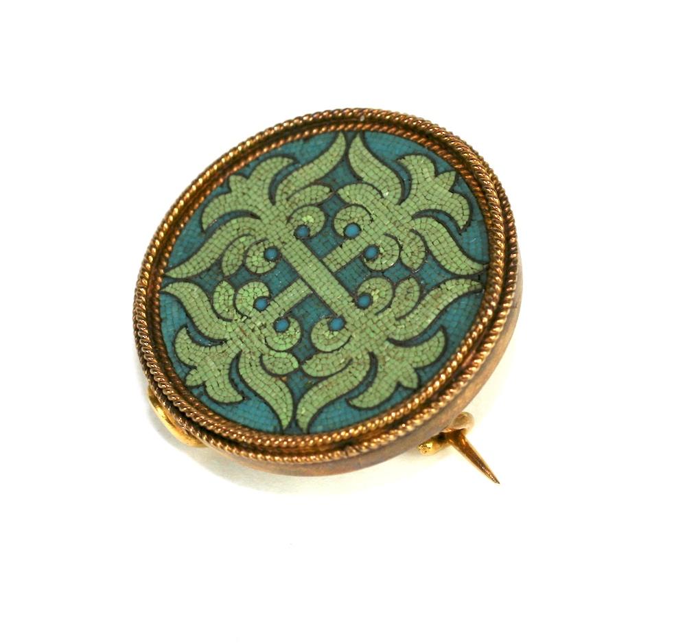 Castellani Micromosaic Brooch from the late 19th Century. Incredibly minute tesserae are hand placed to create the ornate pattern in this wonderful brooch. Patterns of dusty celadon mosaics on a dusty aqua ground. 
Exceptional quality 18k Gold