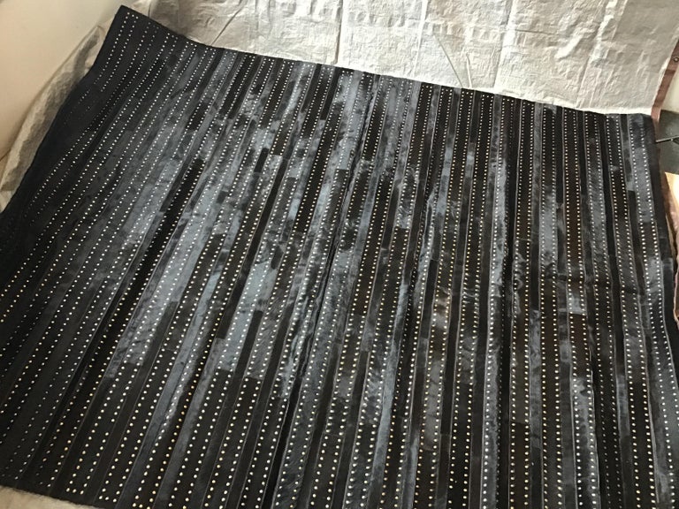 Castelluxe Gemma Design Black Hair on Hide Rug With Brass Tacks For